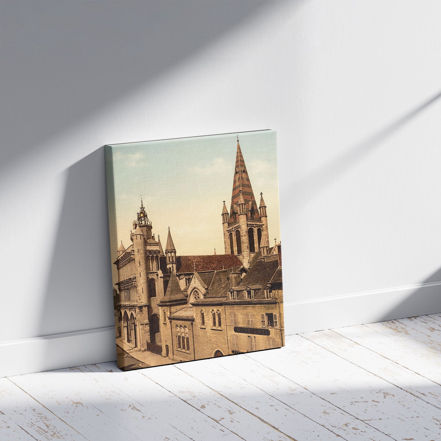 A picture of Notre Dame, Dijon, France, a mockup of the print leaning against a wall