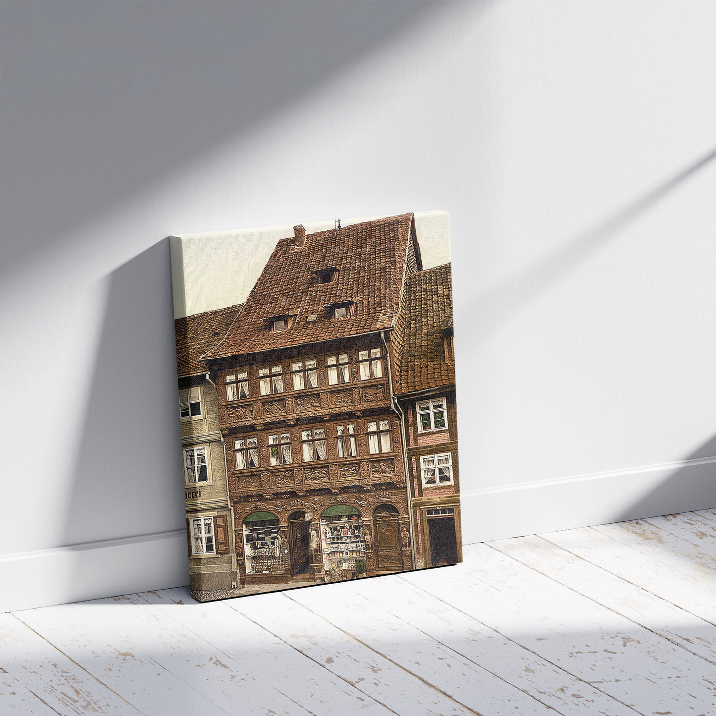 A picture of Old houses, Wernigerode, Hartz, Germany, a mockup of the print leaning against a wall