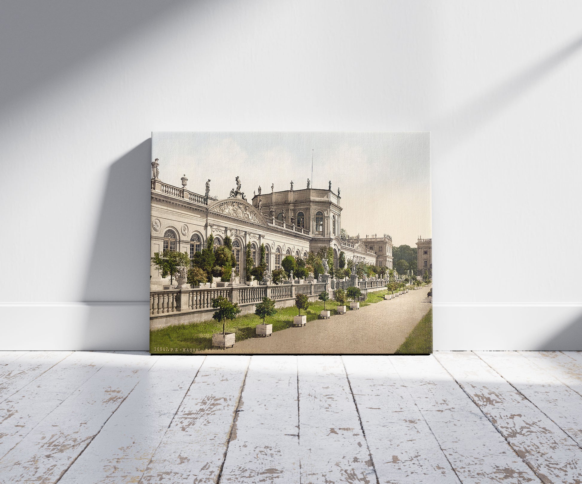 A picture of Orangerie, Karlsaue, Wilhelmshohe, Cassel (i.e., Kassel), Hesse-Nassau, Germany, a mockup of the print leaning against a wall