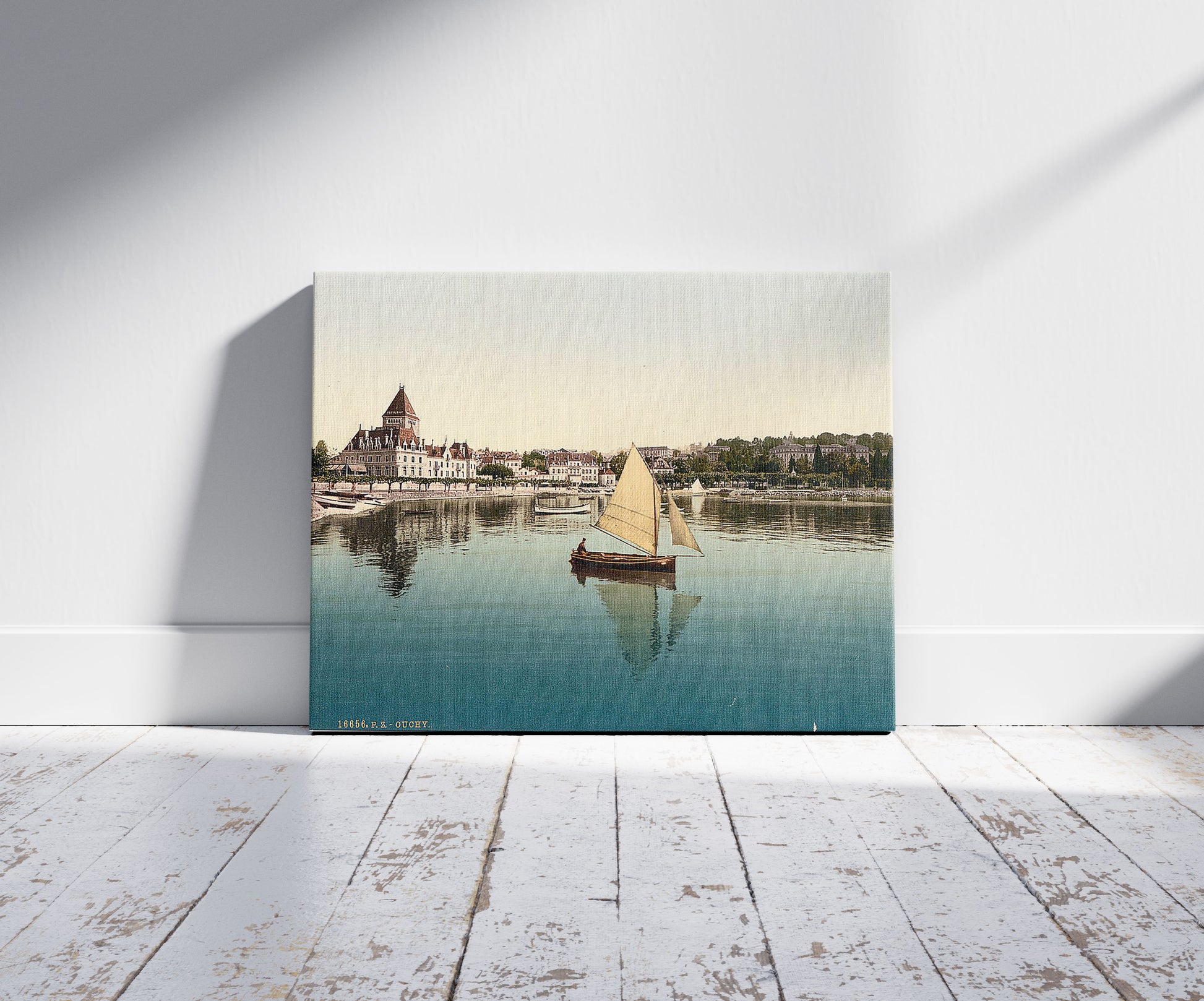 A picture of Ouchy, from the Lake, Geneva Lake, Switzerland, a mockup of the print leaning against a wall