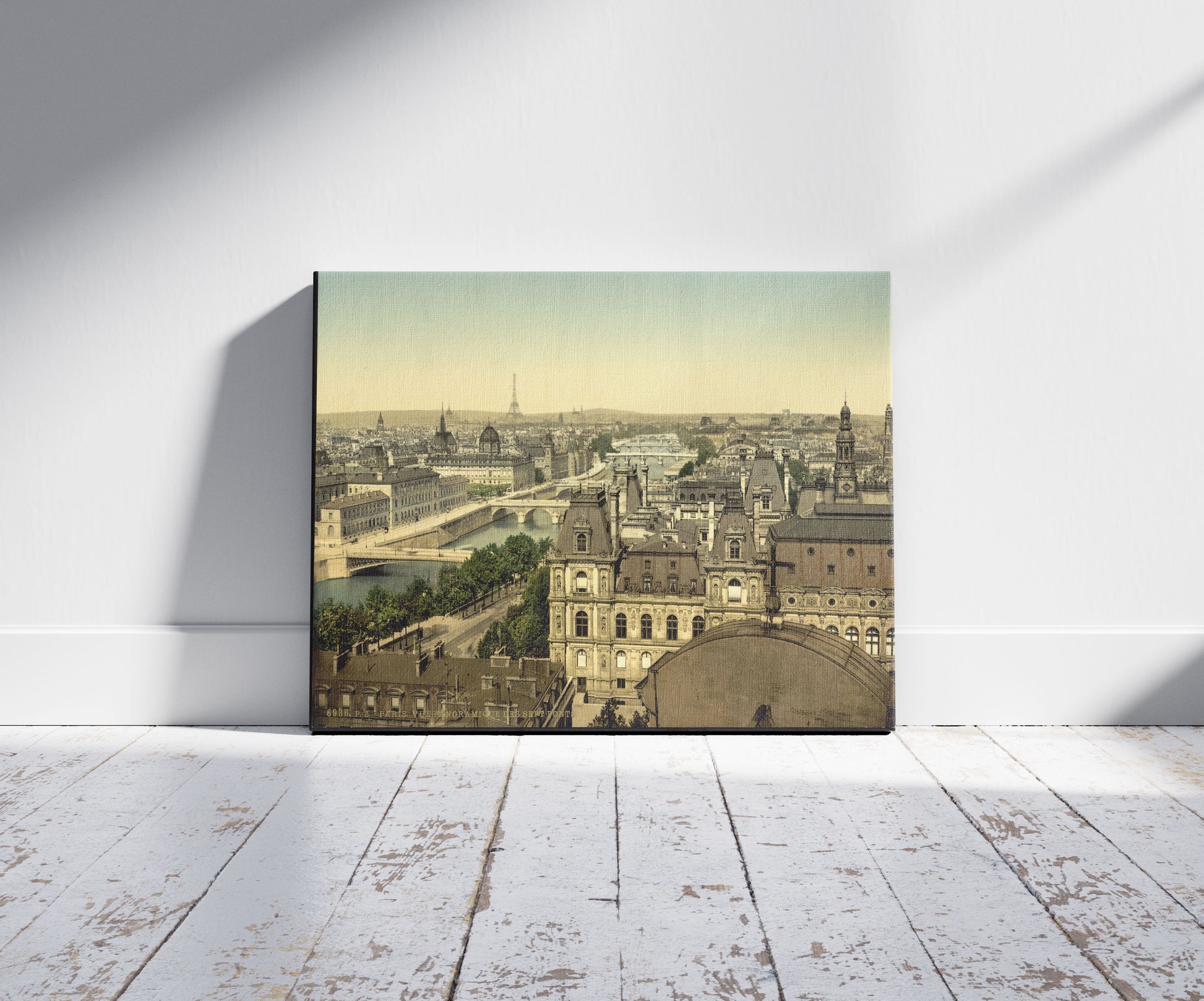 A picture of Panorama of the seven bridges, Paris, France, a mockup of the print leaning against a wall