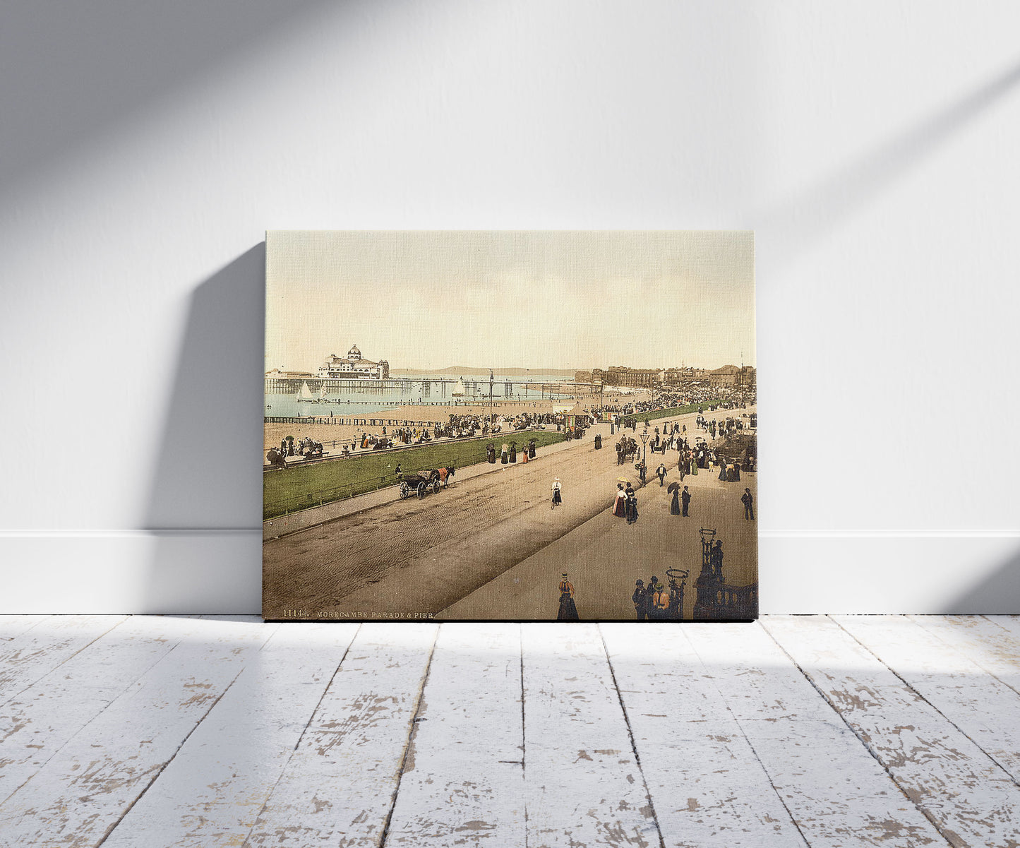 A picture of Parade and pier, Morecambe, England, a mockup of the print leaning against a wall