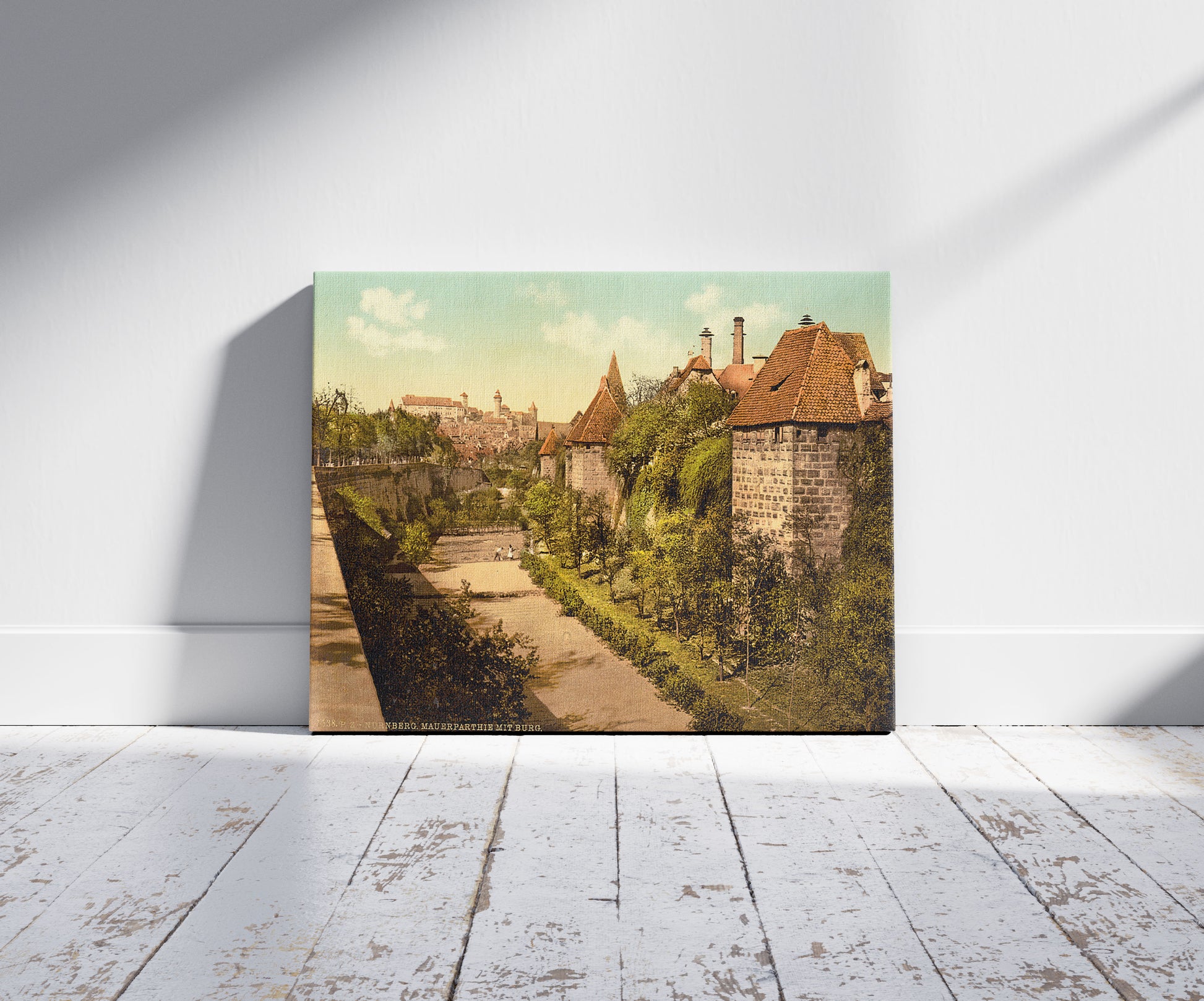 A picture of Part of wall with castle, Nuremberg, Bavaria, Germany, a mockup of the print leaning against a wall