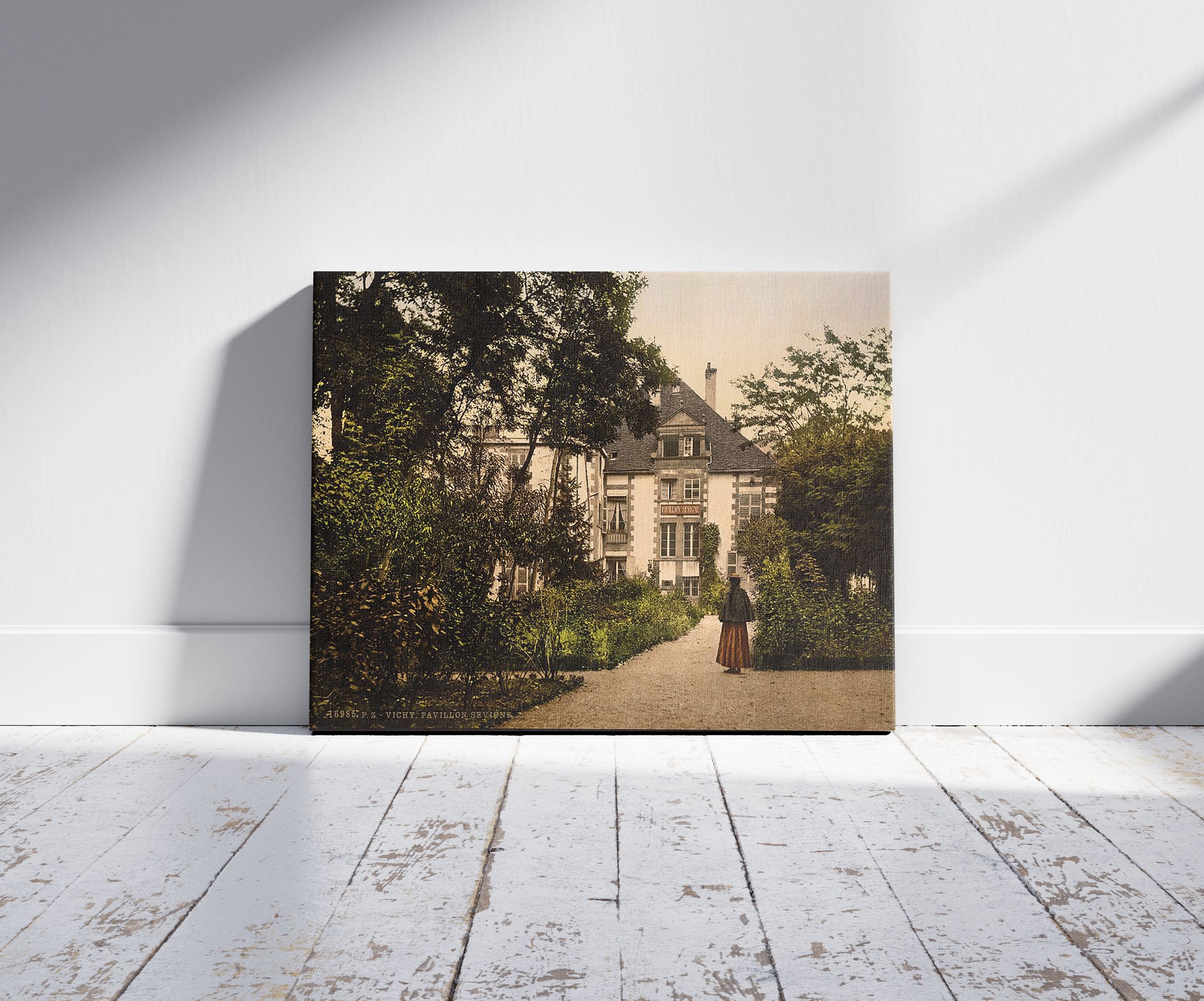 A picture of Pavilion Sevgne (i.e., Sévigné), Vichy, France, a mockup of the print leaning against a wall