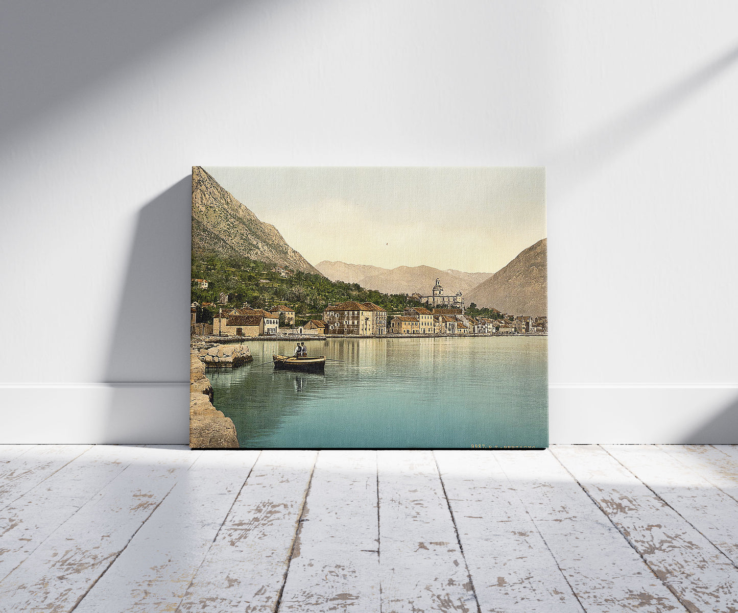 A picture of Perzagno, Dalmatia, Austro-Hungary, a mockup of the print leaning against a wall