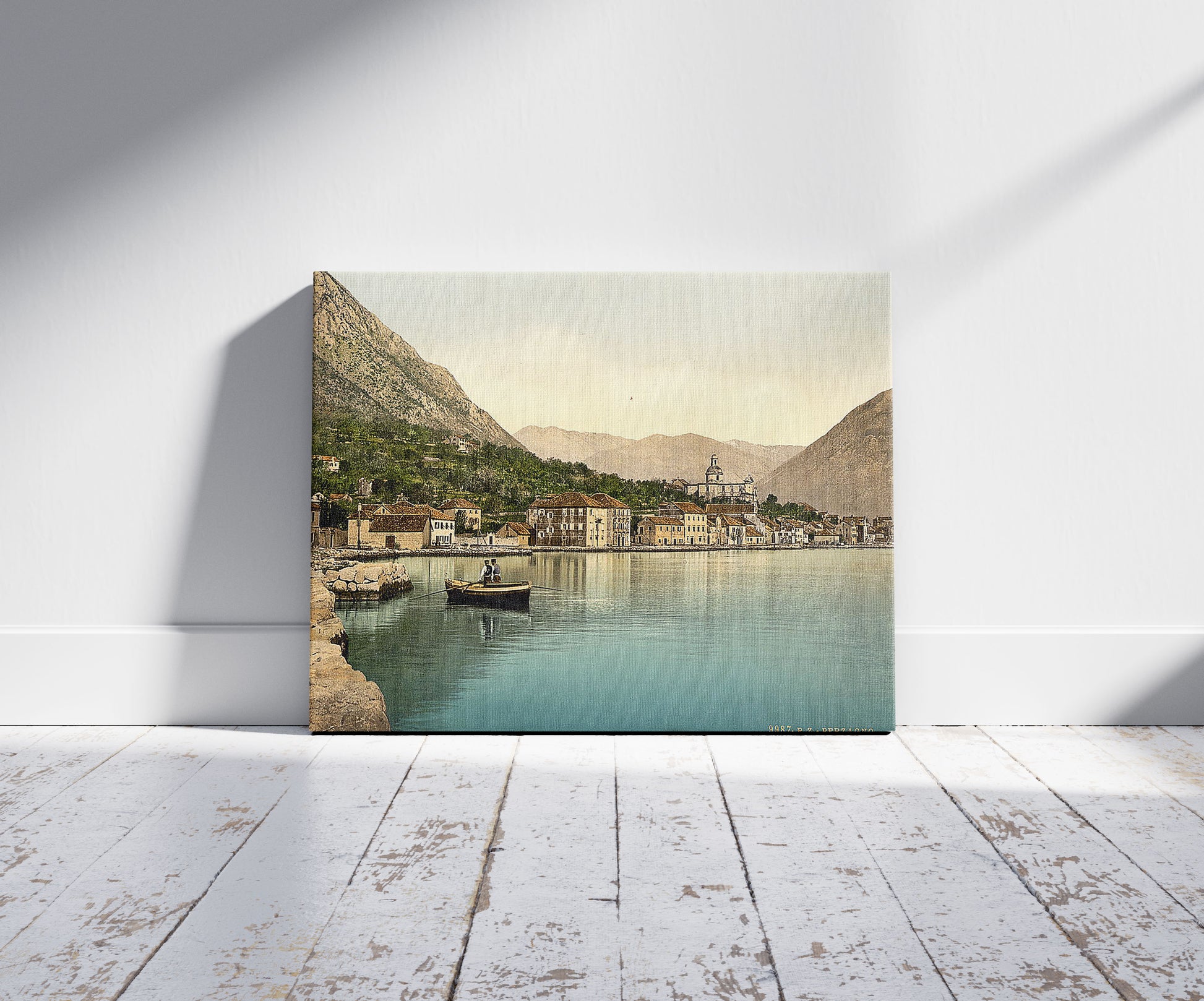 A picture of Perzagno, Dalmatia, Austro-Hungary, a mockup of the print leaning against a wall
