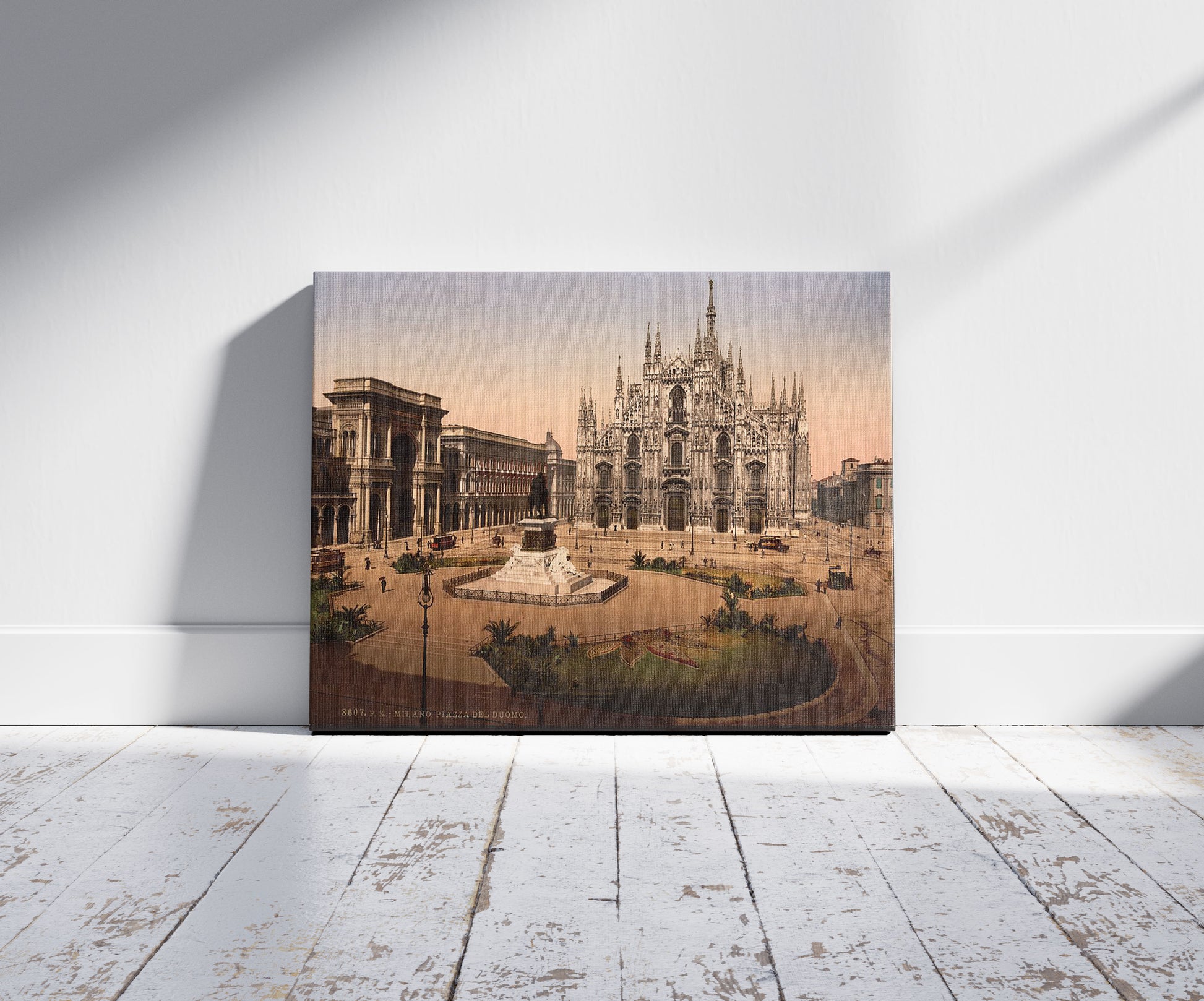 A picture of Piazza del Duomo,  Milan, Italy, a mockup of the print leaning against a wall