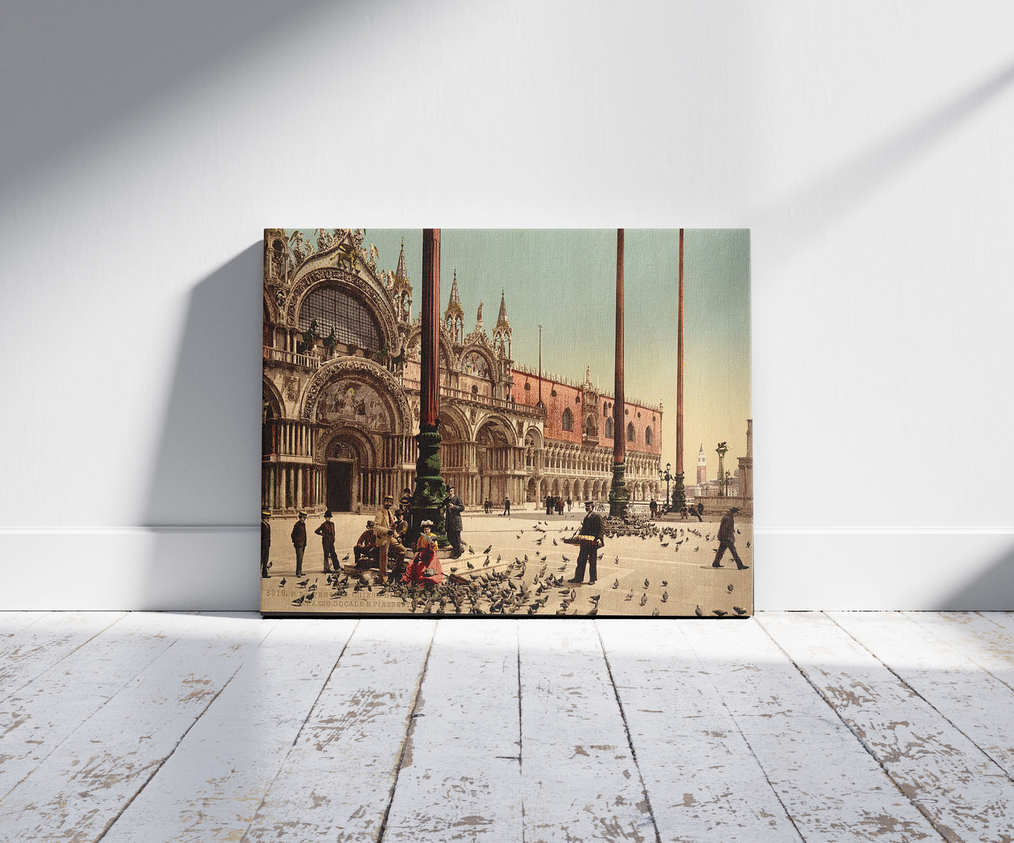 A picture of Pigeons in St. Mark's Place, Venice, Italy, a mockup of the print leaning against a wall