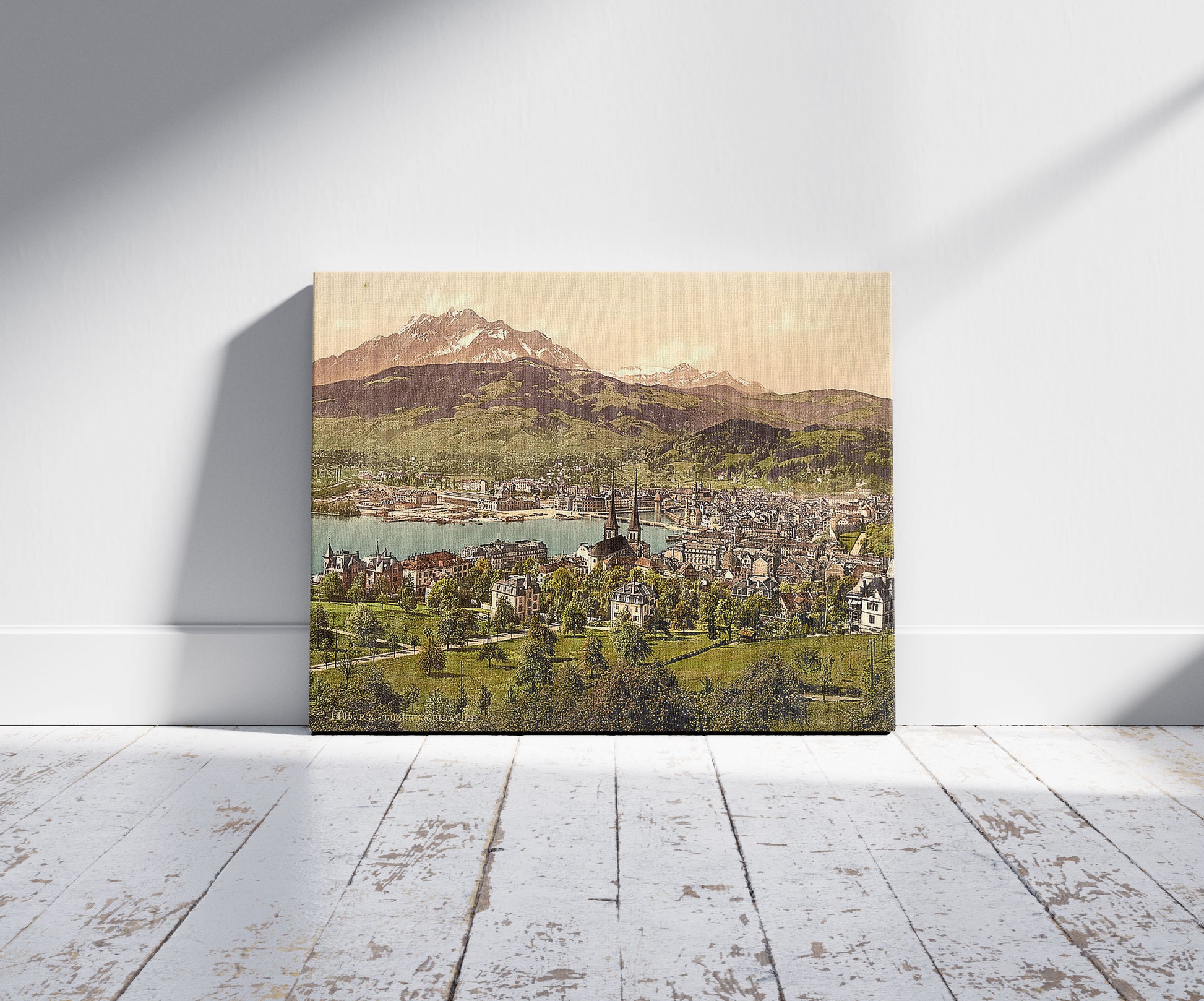 A picture of Pilatus and Lucerne, seen from Drei Linden, Lucerne, Switzerland, a mockup of the print leaning against a wall