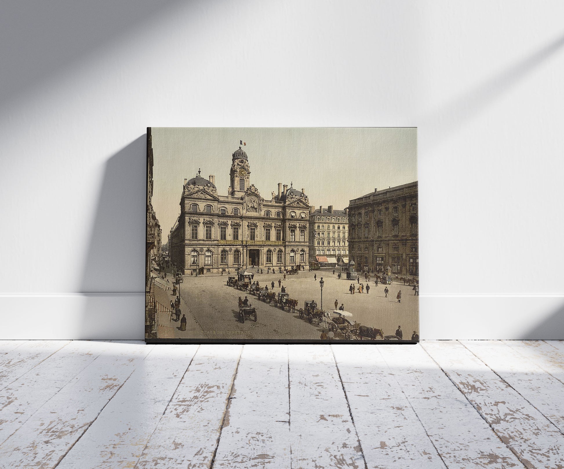 A picture of Place de Terreaux, Lyons, France, a mockup of the print leaning against a wall
