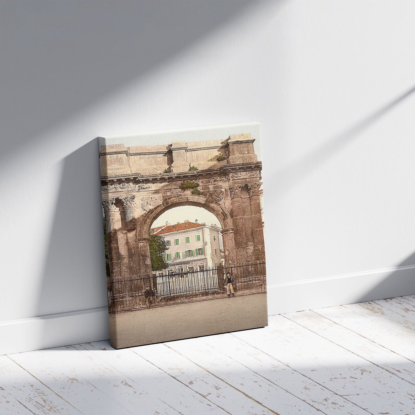 A picture of Pola, Aurea Gate, Istria, Austro-Hungary, a mockup of the print leaning against a wall