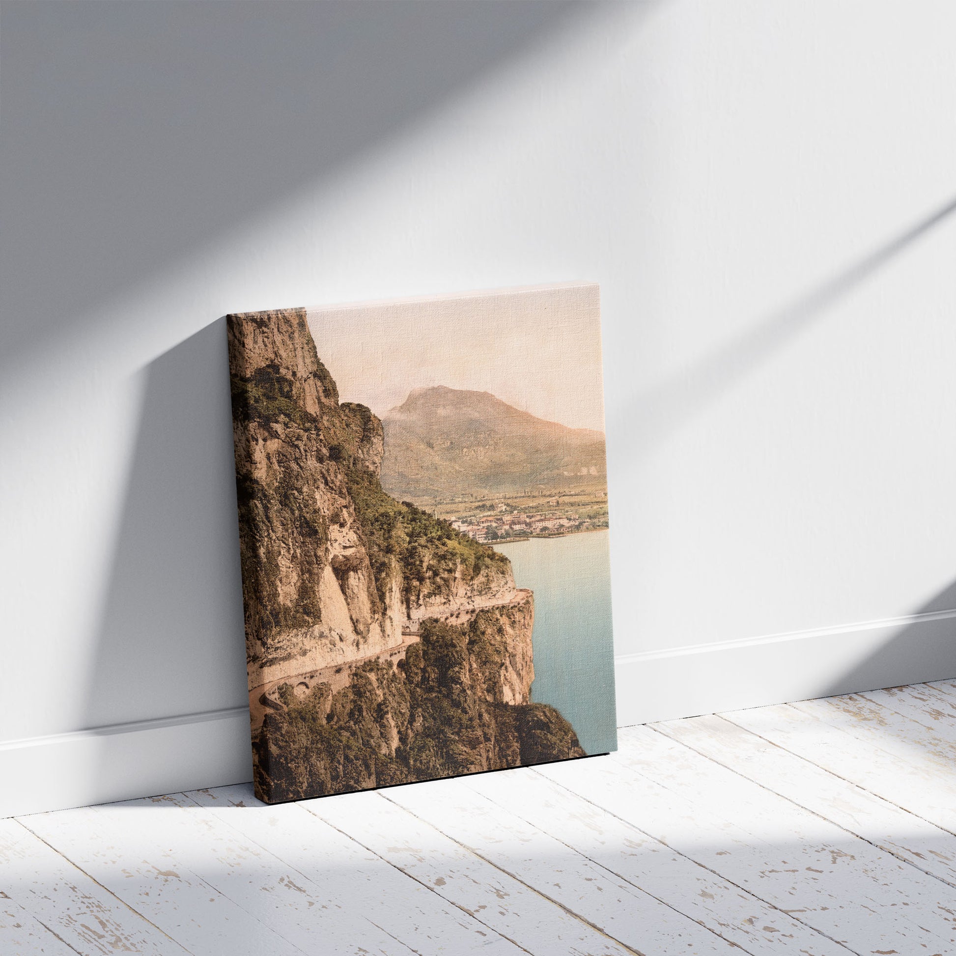 A picture of Ponale Road and view of Riva, Lake Garda, Italy, a mockup of the print leaning against a wall