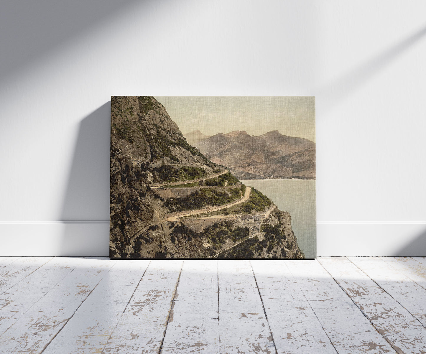 A picture of Ponale Road, Lake Garda, Italy, a mockup of the print leaning against a wall