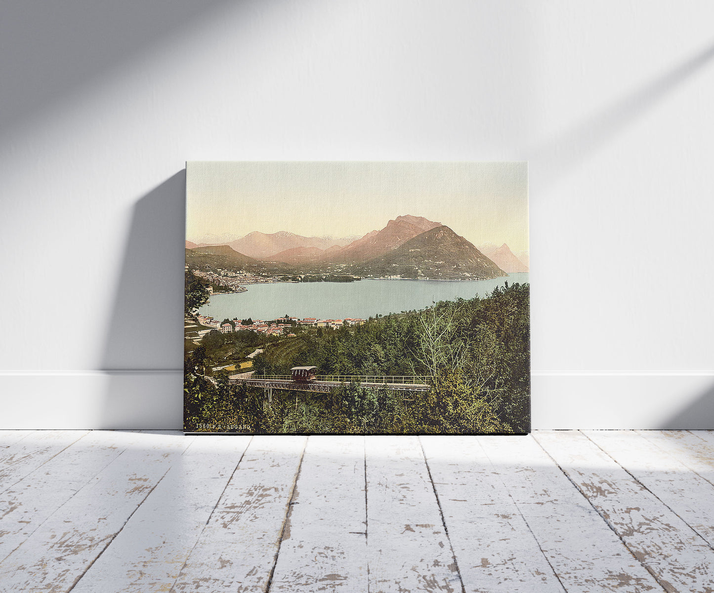 A picture of Porlezza, general view, Tessin, Switzerland, a mockup of the print leaning against a wall