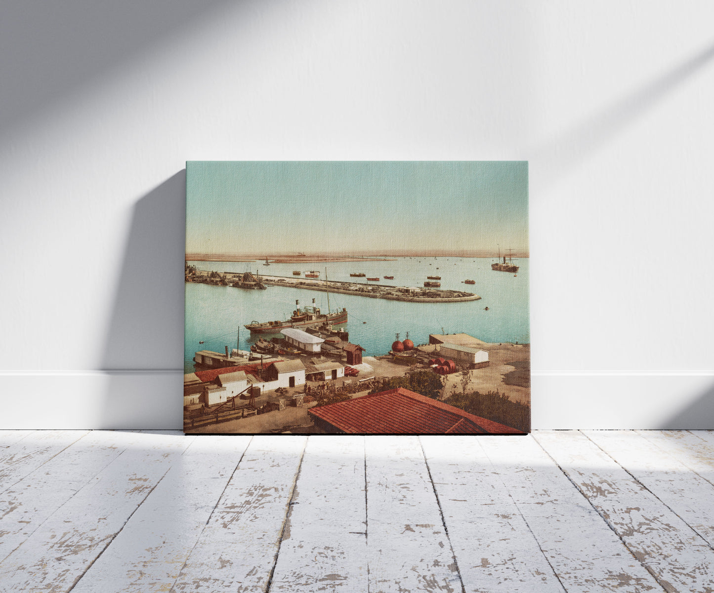 A picture of Port Tewfic, entrée du canal de Suez, a mockup of the print leaning against a wall