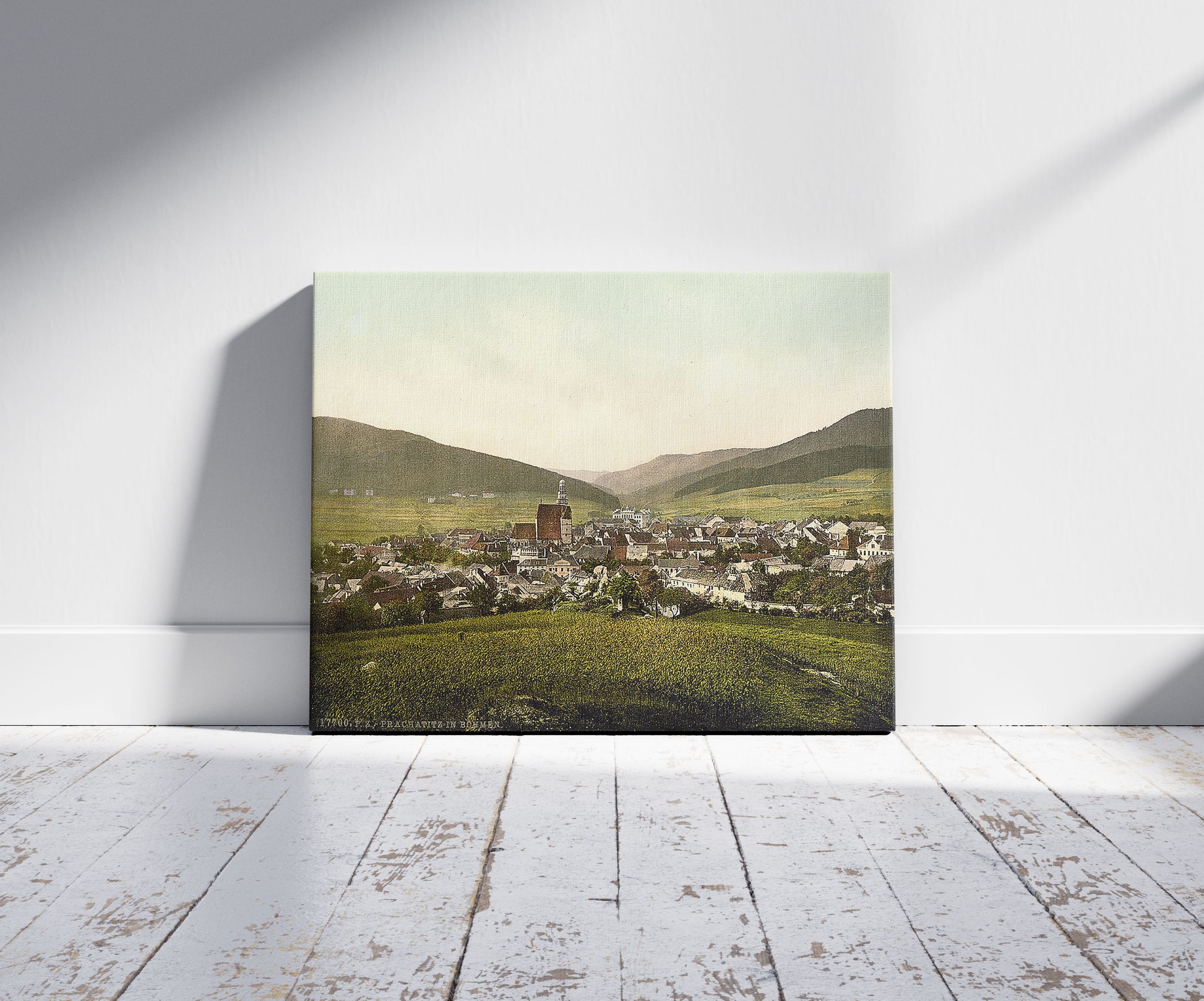 A picture of Prachatitz, Bohemian Switzerland, Bohemia, Austro-Hungary, a mockup of the print leaning against a wall
