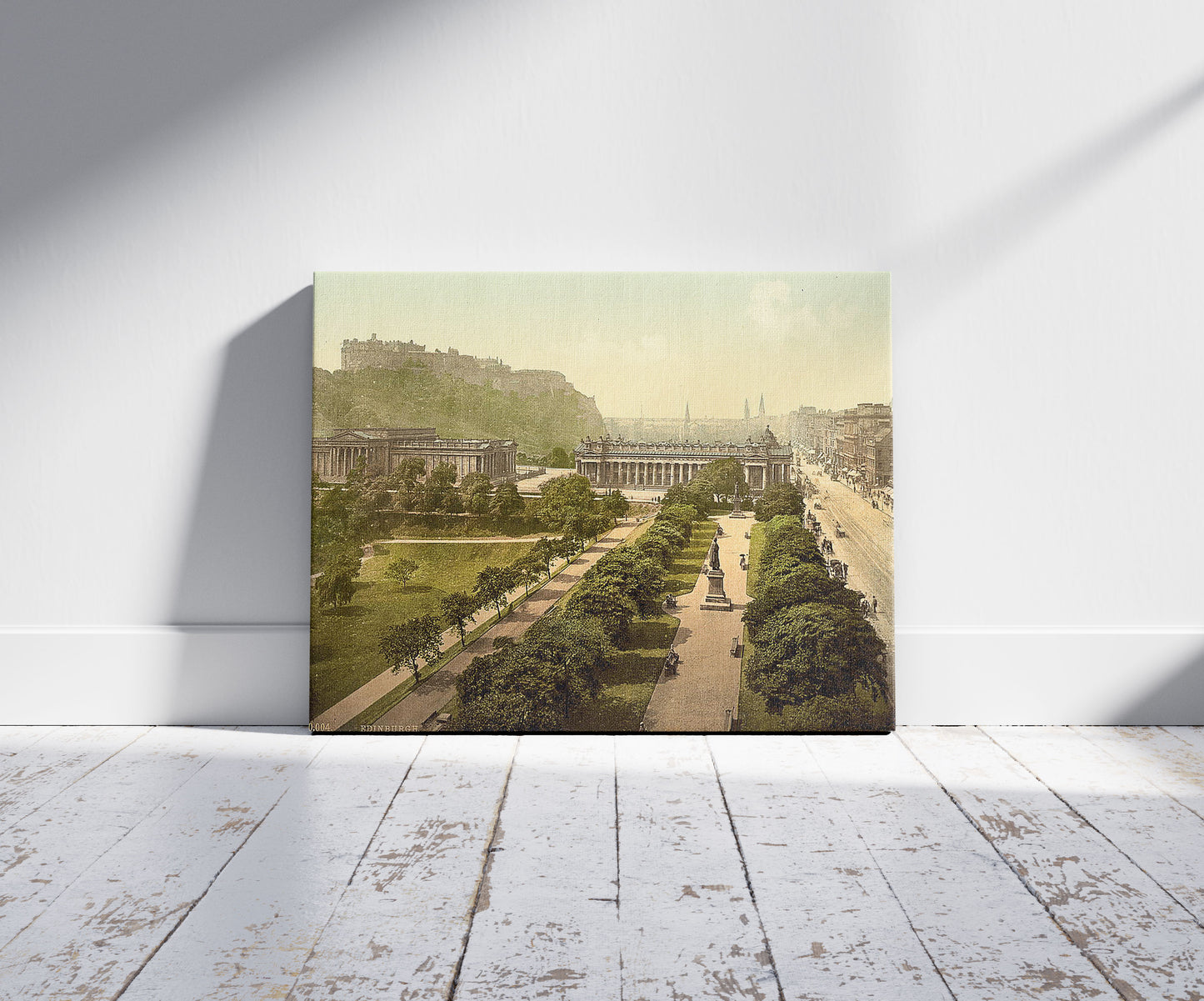 A picture of Princess Street (i.e. Princes Street) and castle from Scott's Monument, Edinburgh, Scotland, a mockup of the print leaning against a wall