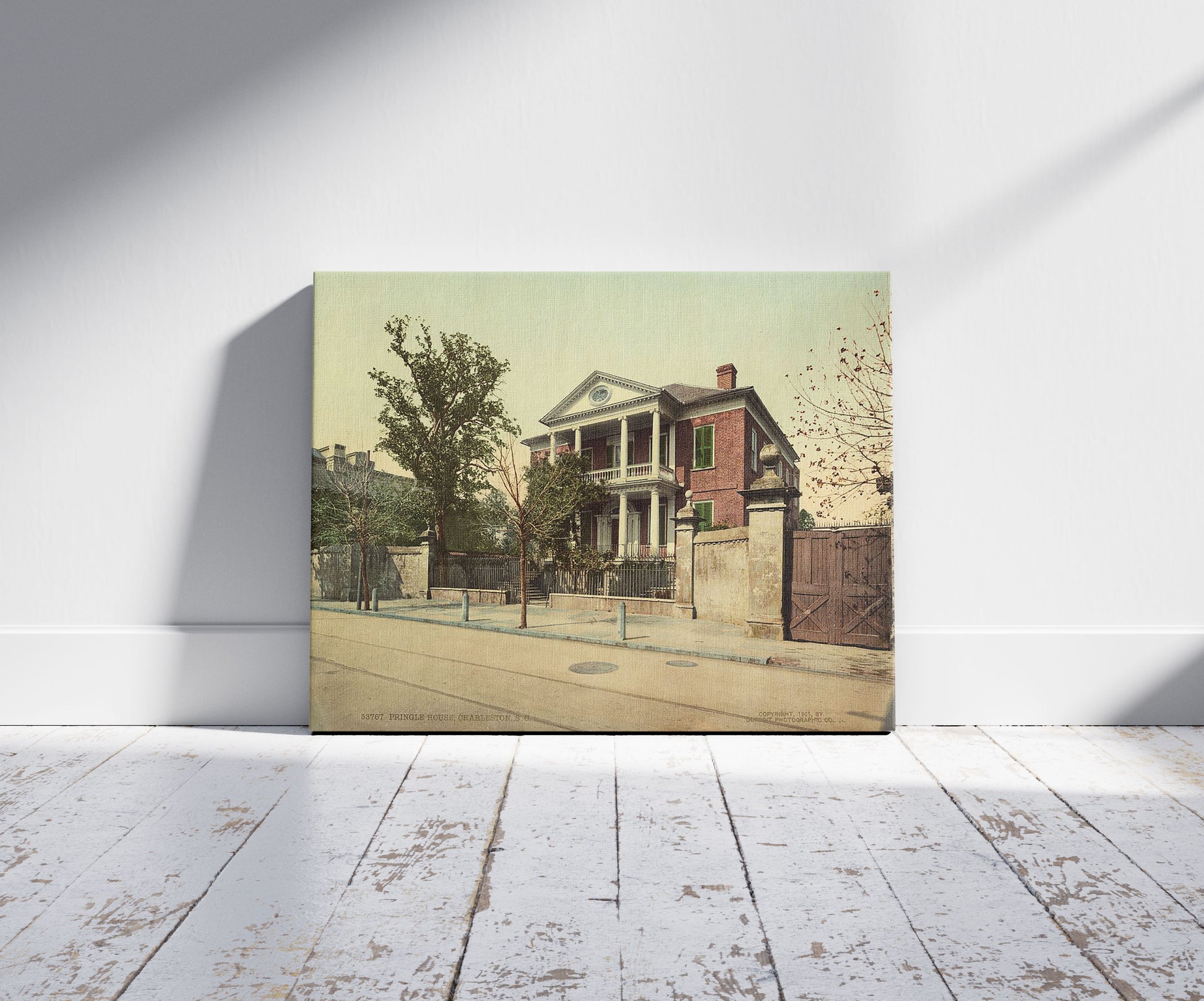 A picture of Pringle House, Charleston, S.C., a mockup of the print leaning against a wall