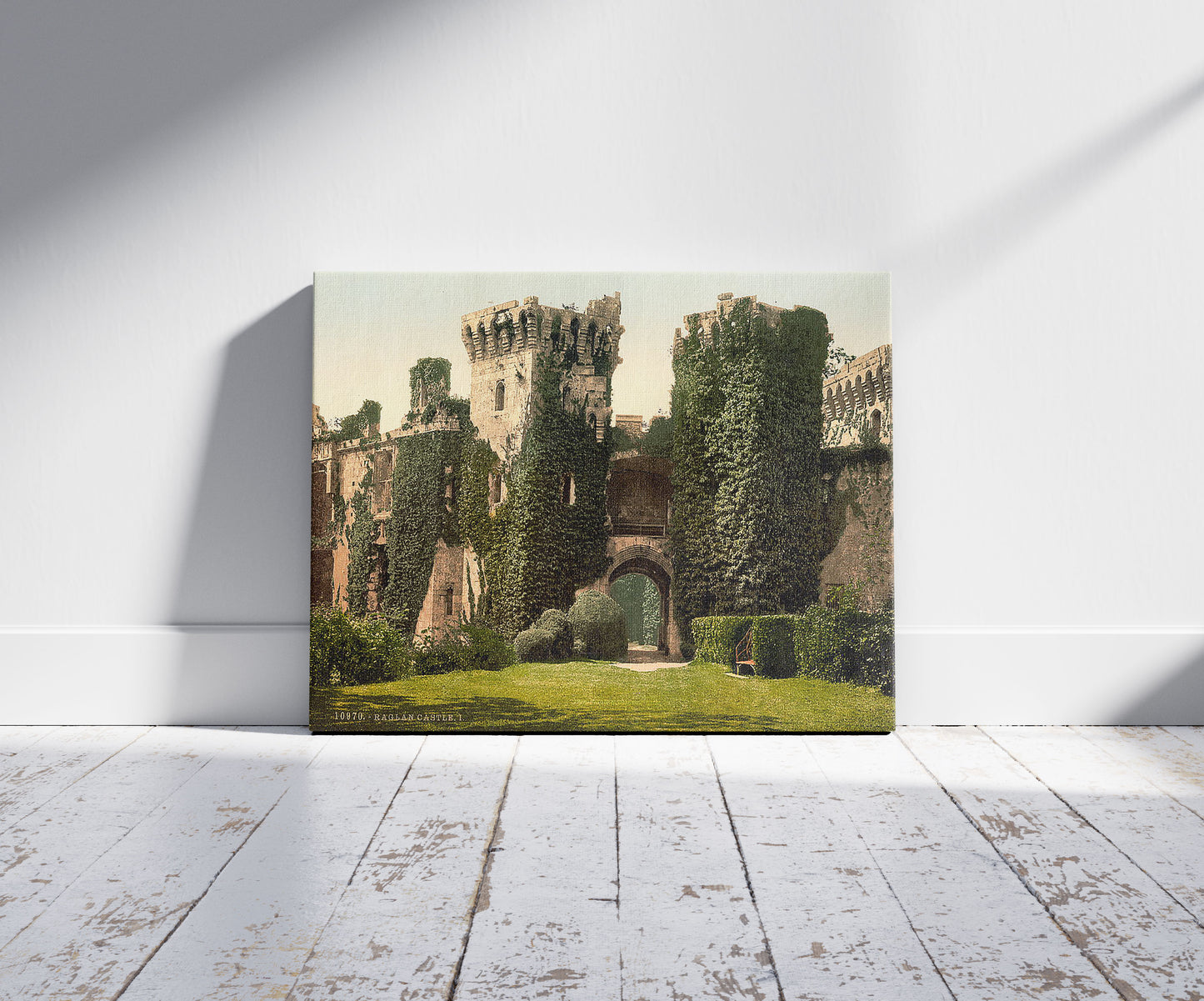 A picture of Raglan Castle, I., Wales, a mockup of the print leaning against a wall