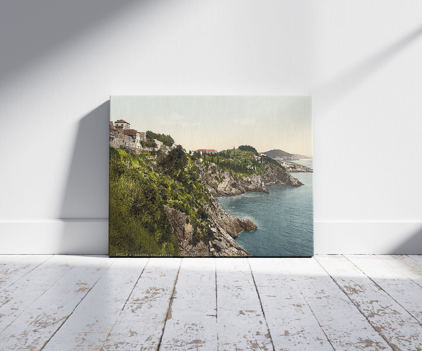 A picture of Ragusa, Bella Vista, Dalmatia, Austro-Hungary, a mockup of the print leaning against a wall