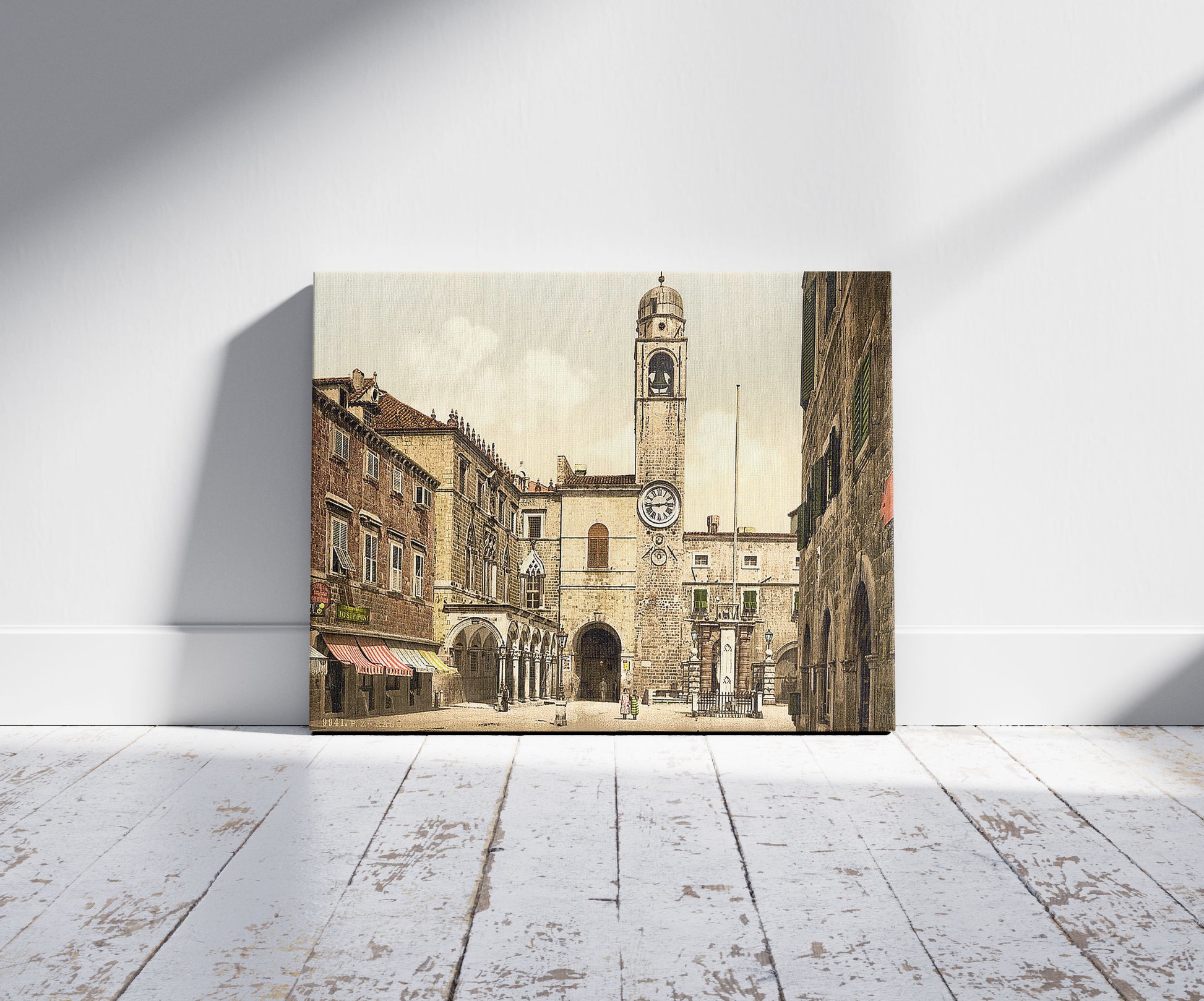 A picture of Ragusa, Corpi di Guardi Square, Dalmatia, Austro-Hungary, a mockup of the print leaning against a wall