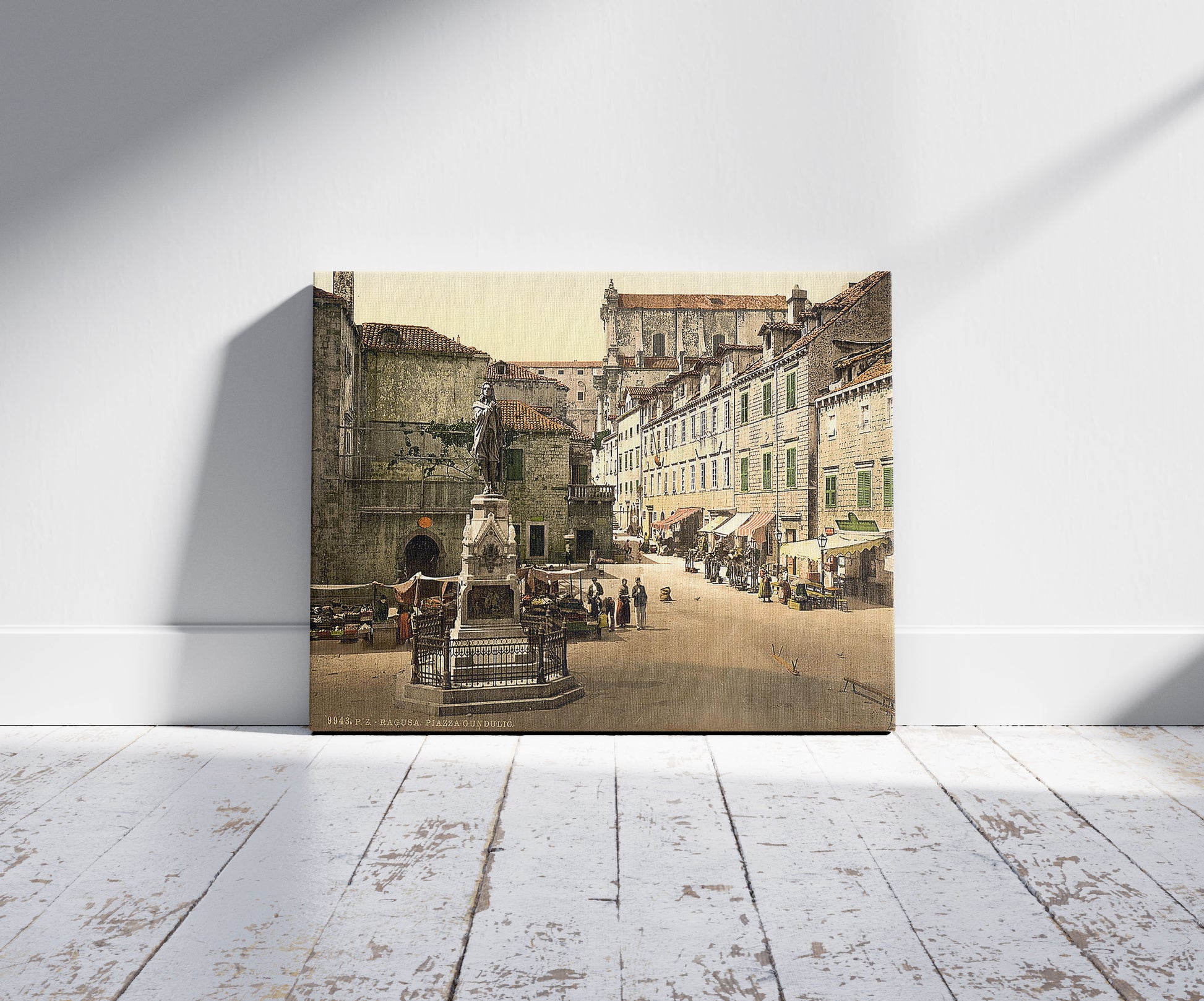 A picture of Ragusa, Gundulic Square, Dalmatia, Austro-Hungary, a mockup of the print leaning against a wall
