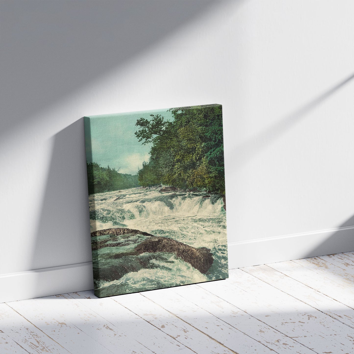 A picture of Raquette Falls, Adirondack Mountains, a mockup of the print leaning against a wall