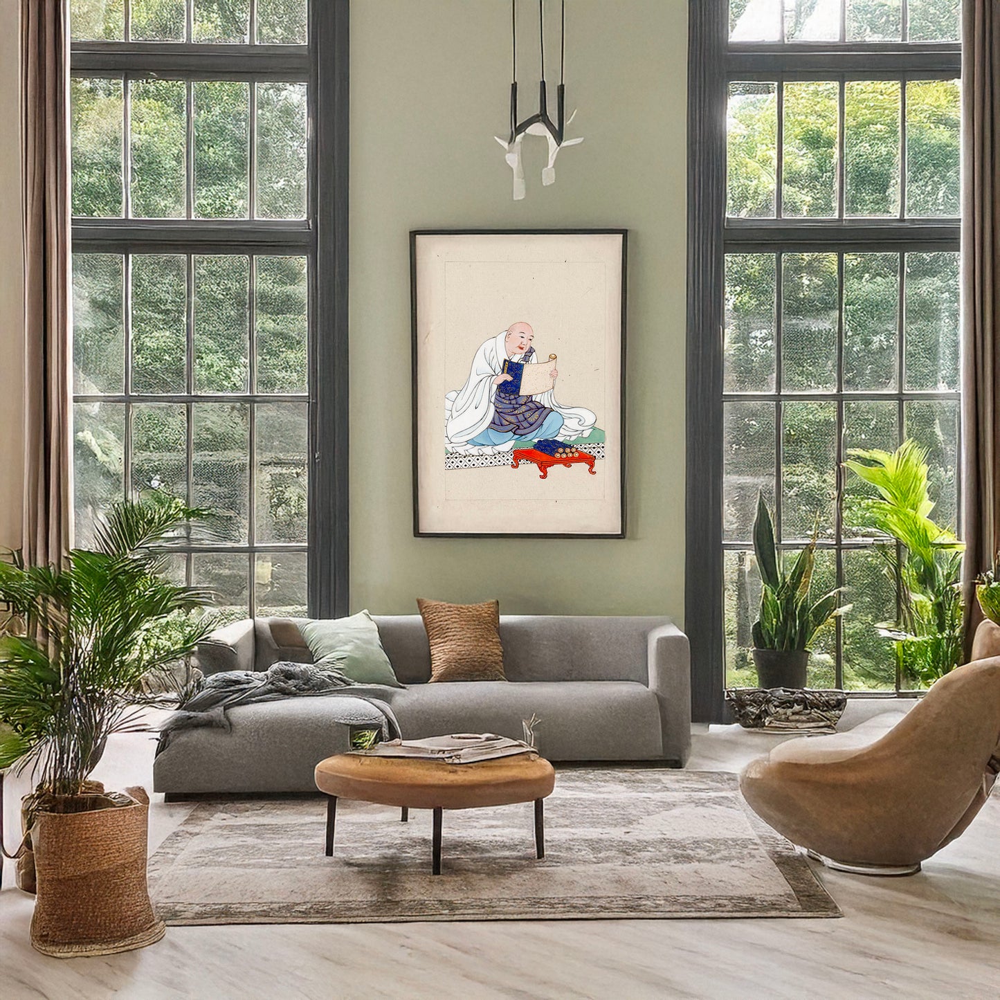 A picture of Religious figure, probably a monk, seated, facing slightly right, reading a scroll, several scrolls are on a table in front of him, a mockup of the print leaning against a wall