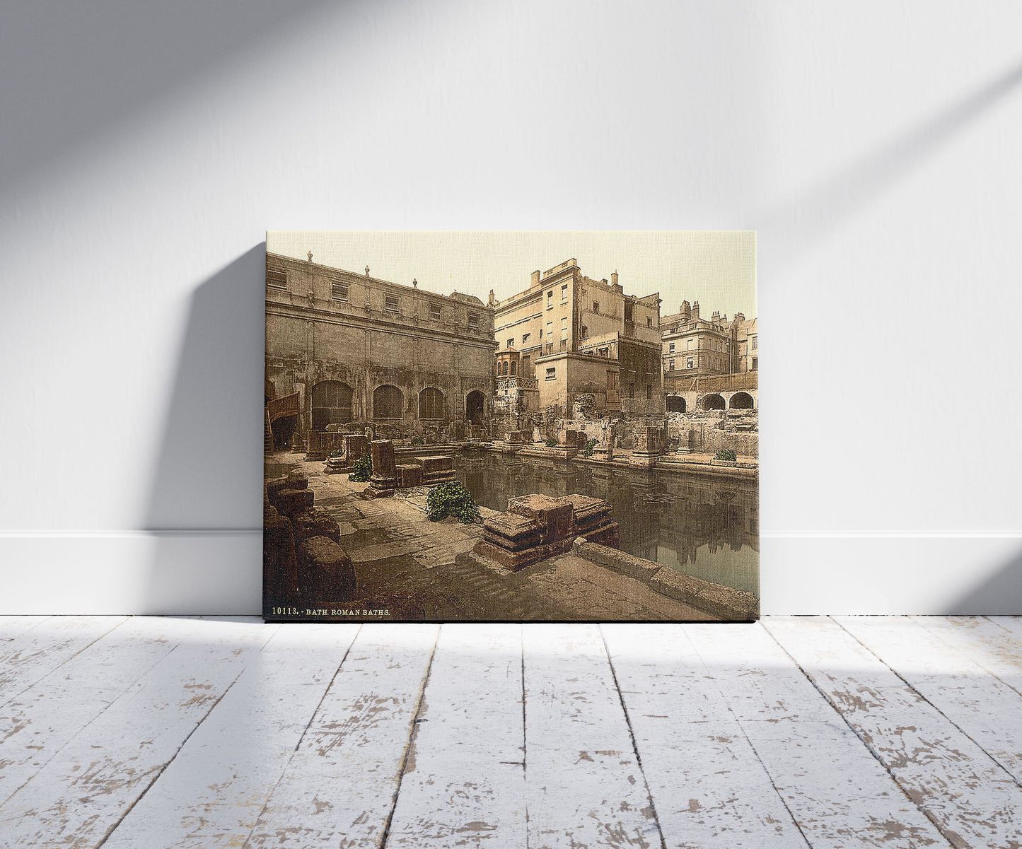 A picture of Roman Baths and Abbey, Bath, England, a mockup of the print leaning against a wall