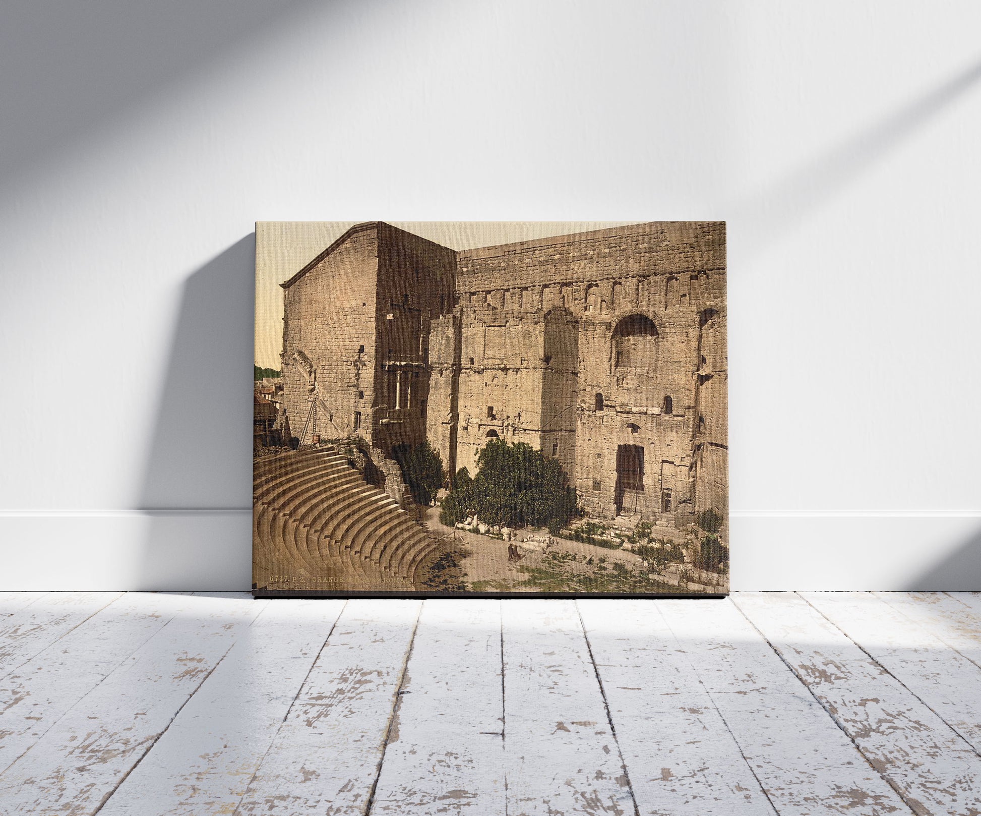 A picture of Roman theatre, Orange, Provence, France, a mockup of the print leaning against a wall