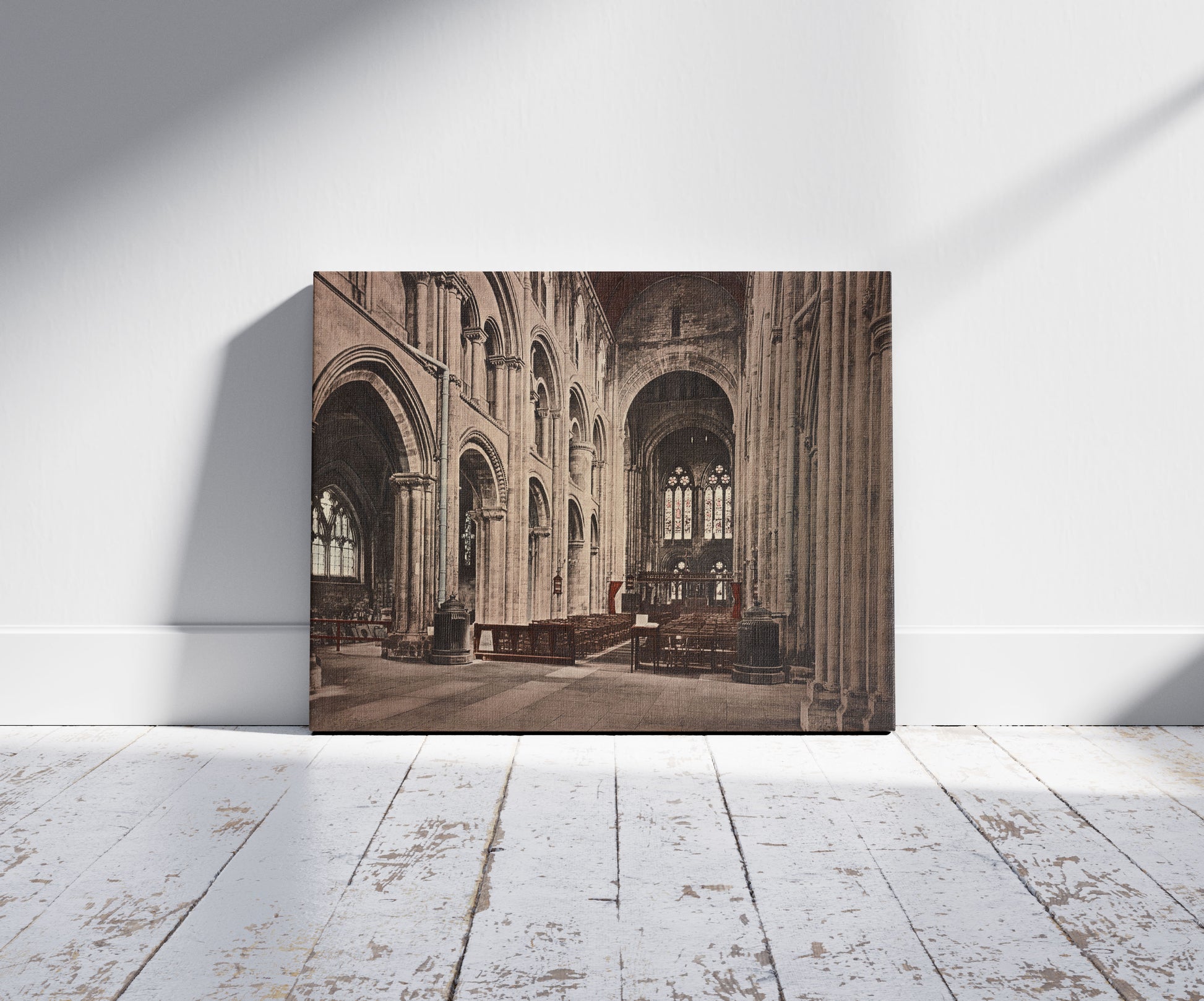 A picture of Romsey Abbey. The Nave Looking E, a mockup of the print leaning against a wall