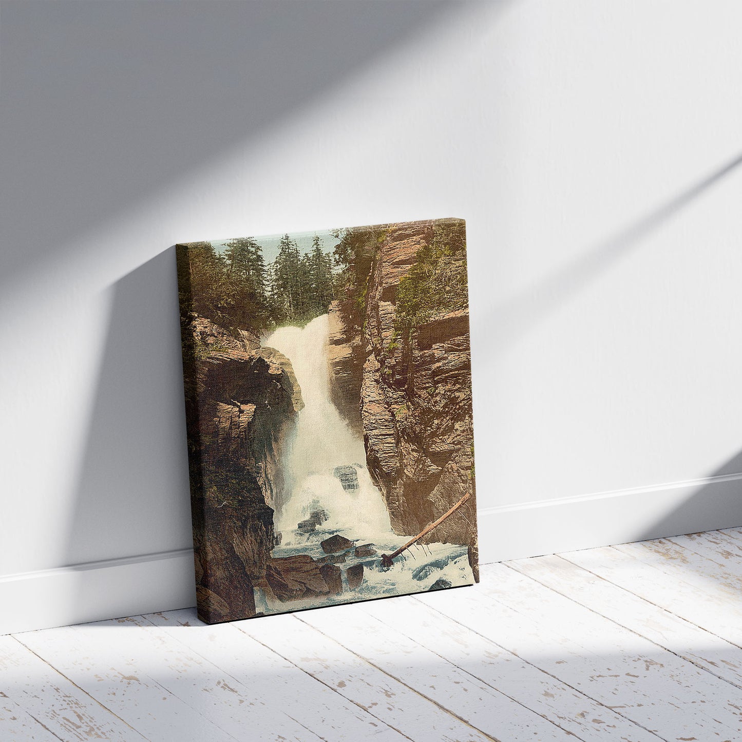 A picture of Rosenlaui, waterfall, Bernese Oberland, Switzerland, a mockup of the print leaning against a wall