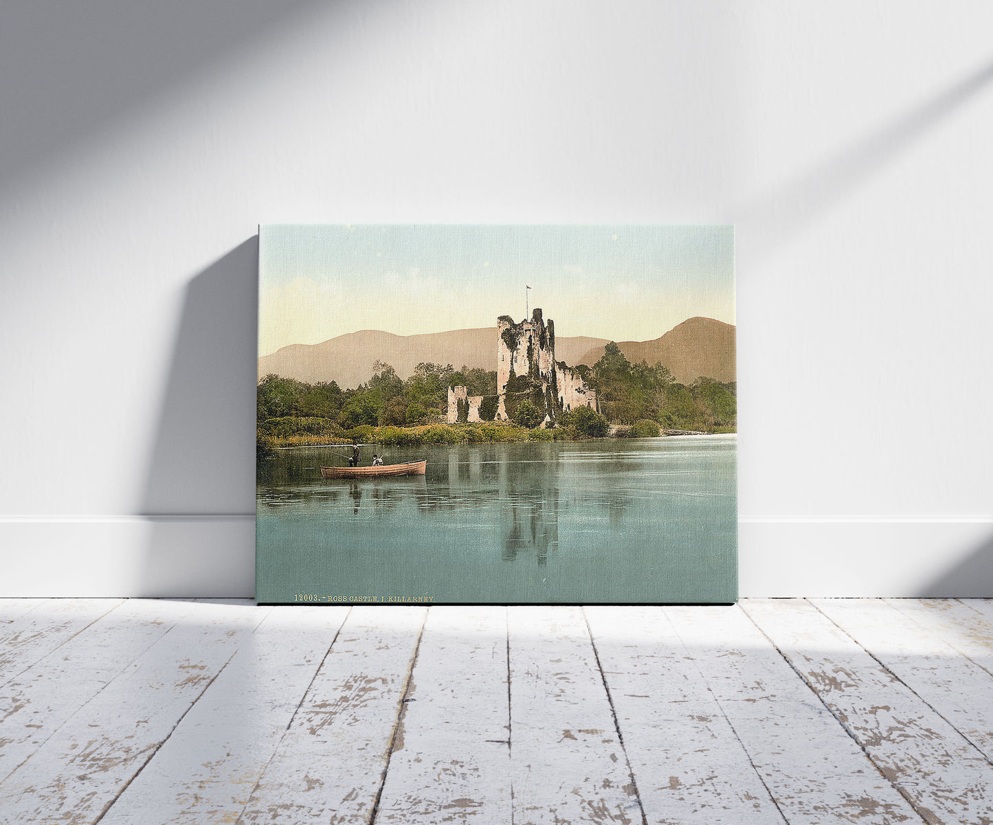 A picture of Ross Castle, I, Killarney. County Kerry, Ireland, a mockup of the print leaning against a wall