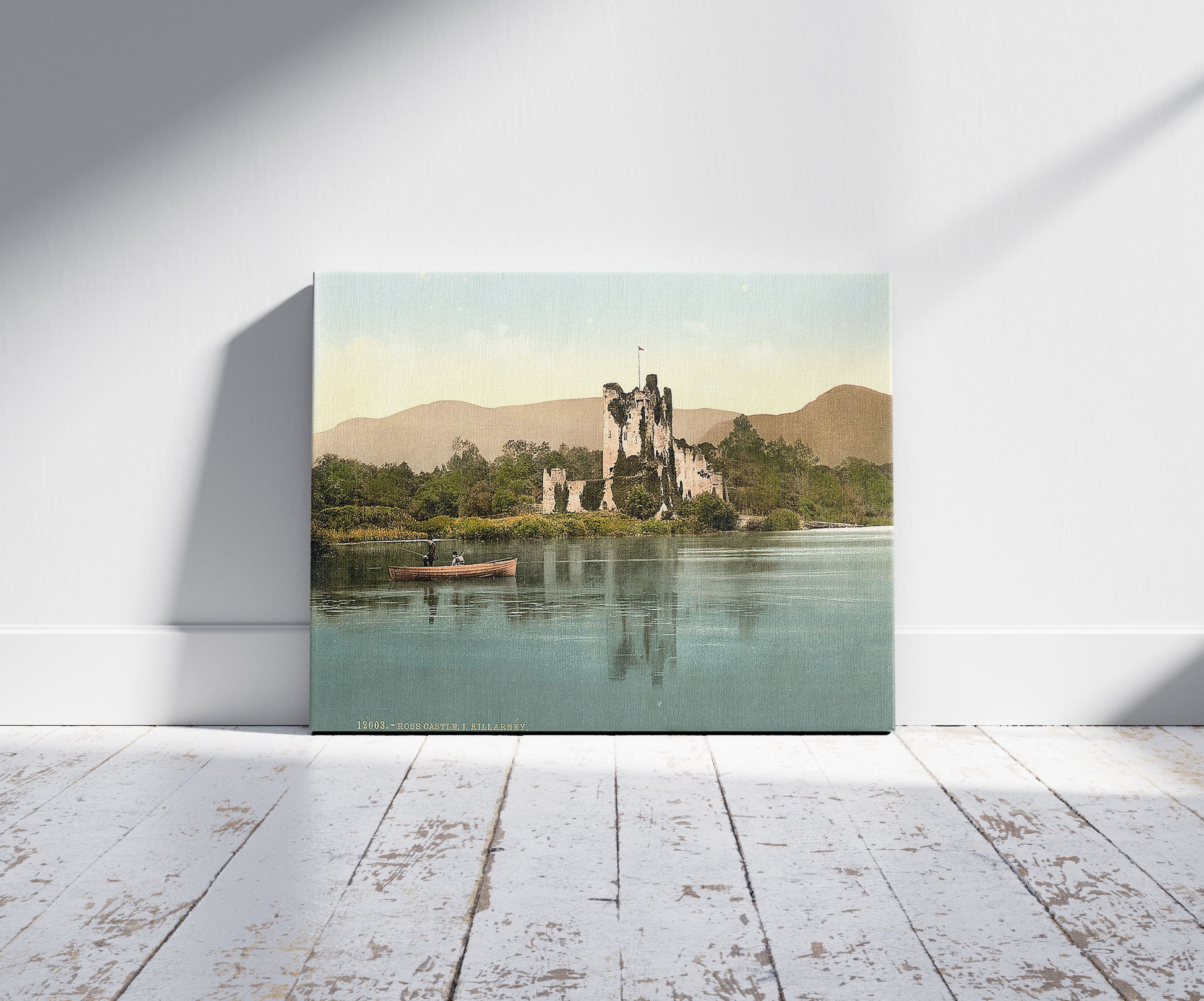 A picture of Ross Castle, I, Killarney. County Kerry, Ireland, a mockup of the print leaning against a wall