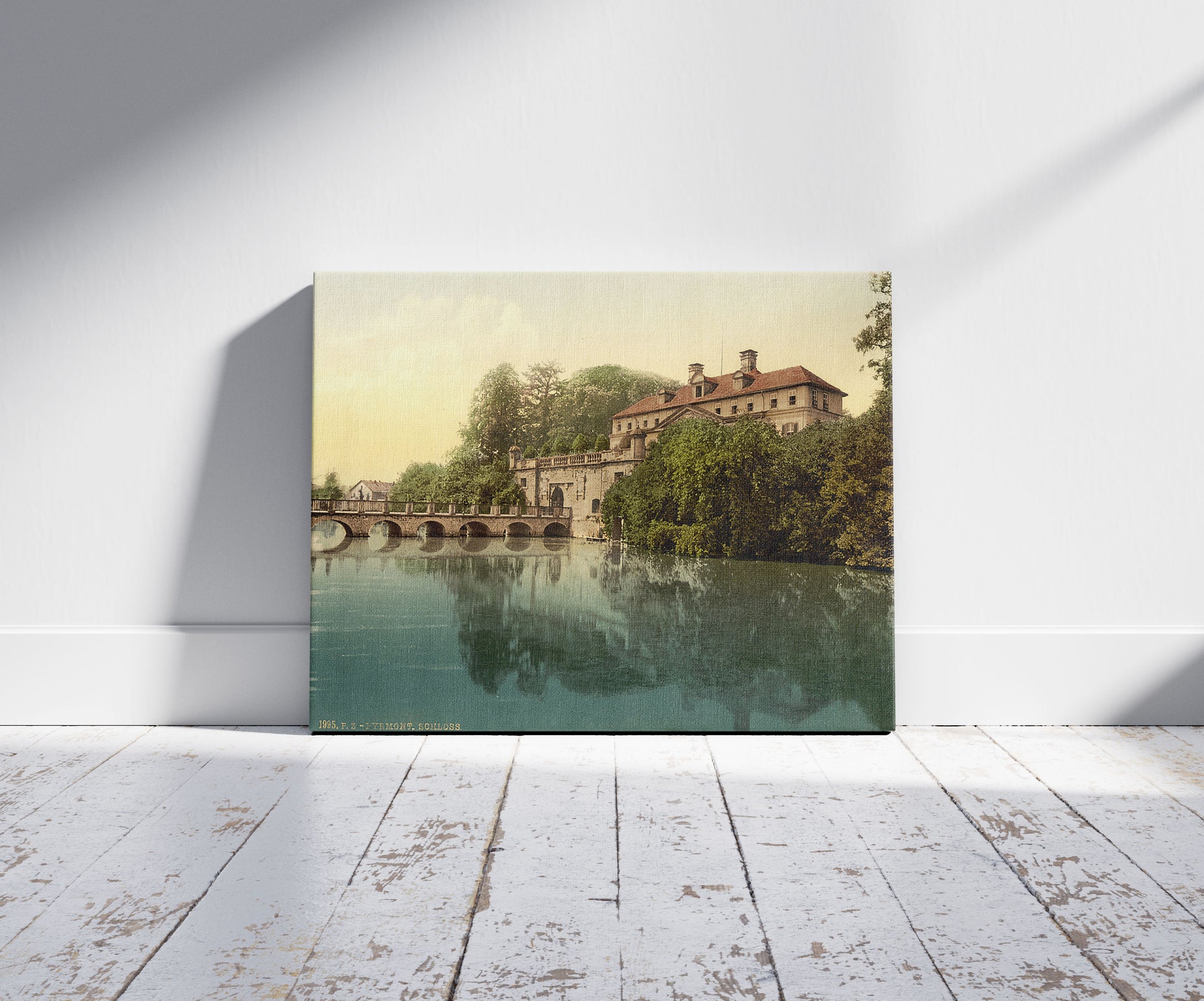 A picture of Royal castle, Pyrmont (i.e., Bad Pyrmont), Germany, a mockup of the print leaning against a wall