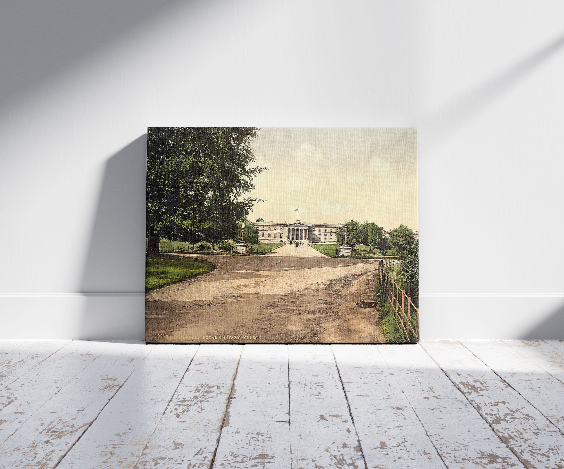 A picture of Royal Military College, Sandhurst, Camberley, England, a mockup of the print leaning against a wall