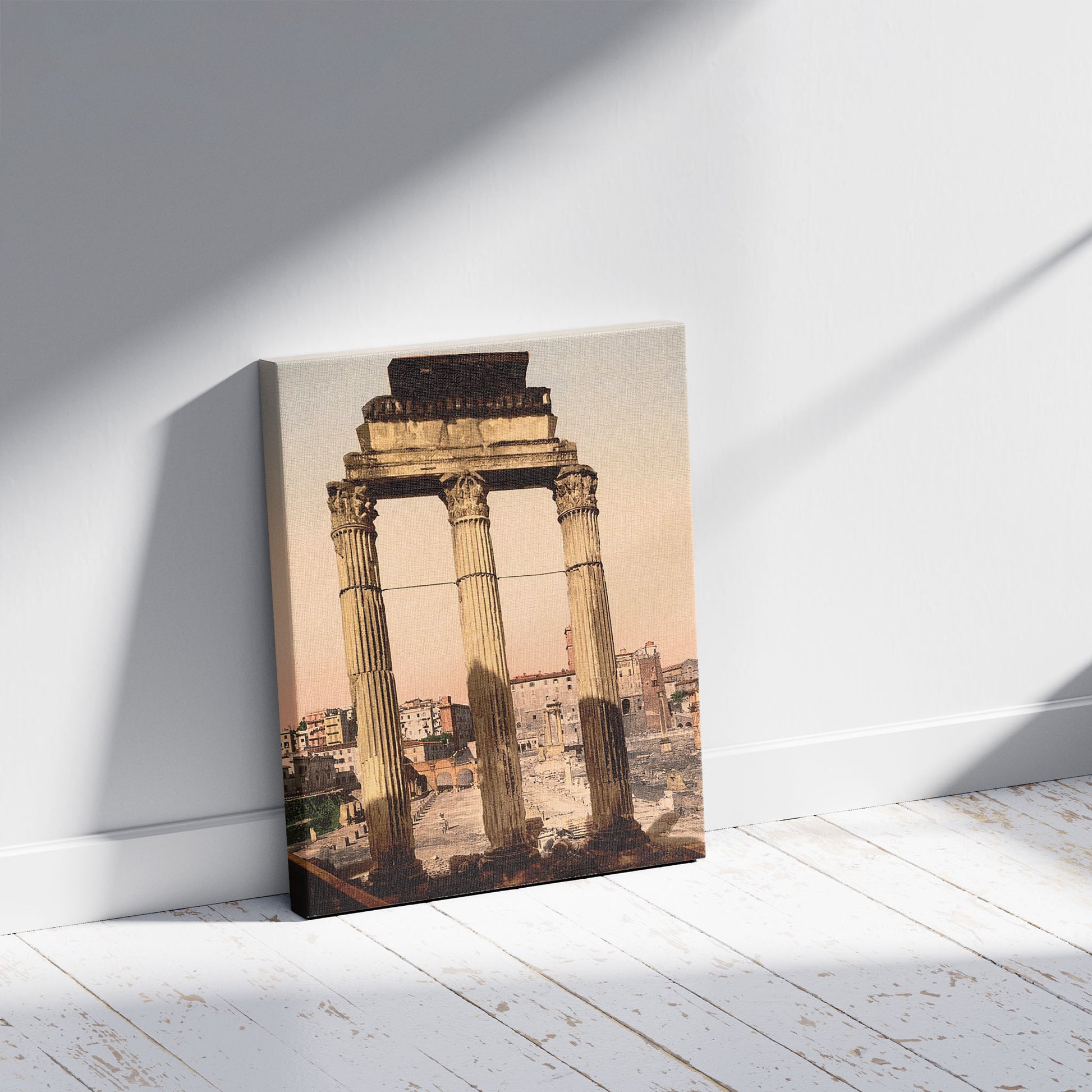 A picture of Ruins of Temple of Castor and Pollux, Rome, Italy, a mockup of the print leaning against a wall