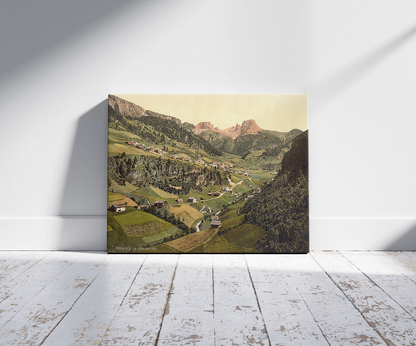 A picture of Santa Christiana (i.e., Santa Christiana Val Gardena), Tyrol, Austro-Hungary, a mockup of the print leaning against a wall