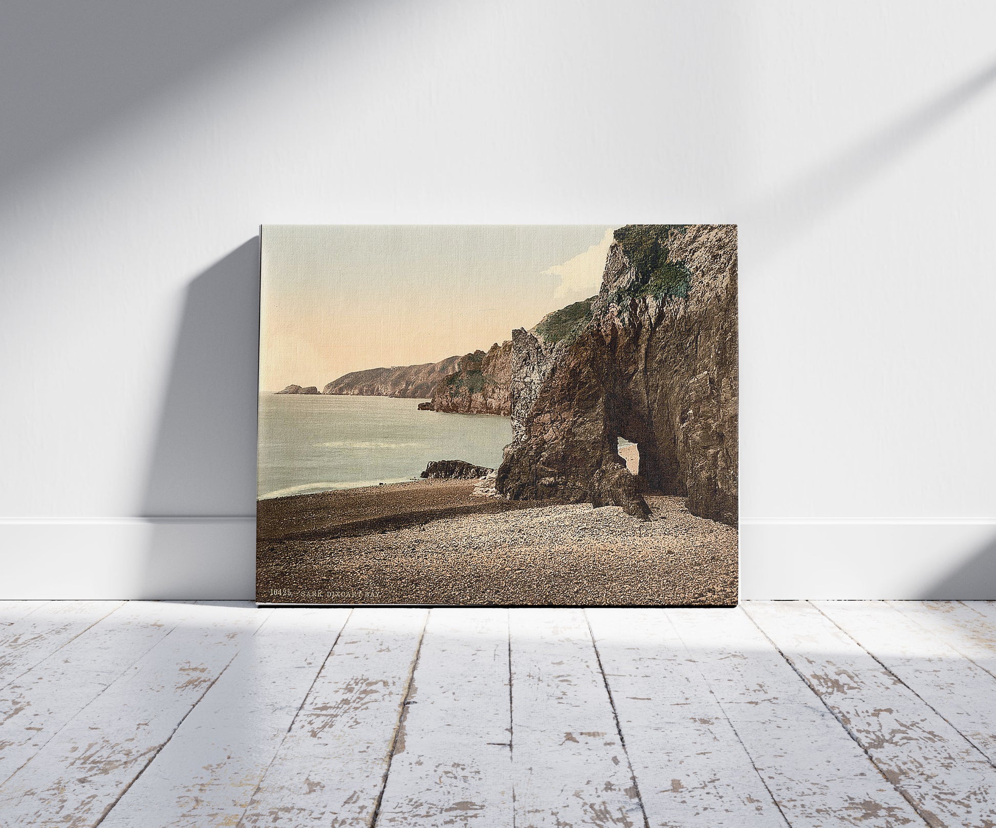 A picture of Sark, Dixcart Bay, Channel Islands, a mockup of the print leaning against a wall