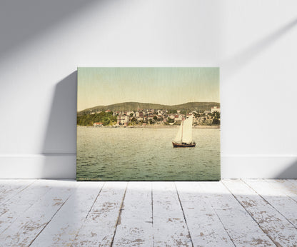 A picture of Sassnitz, seen from the water, Isle of Rugen, Germany, a mockup of the print leaning against a wall