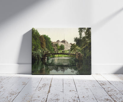 A picture of Scene in the Botanical Gardens with Director of Customs Building, Hamburg, Germany, a mockup of the print leaning against a wall