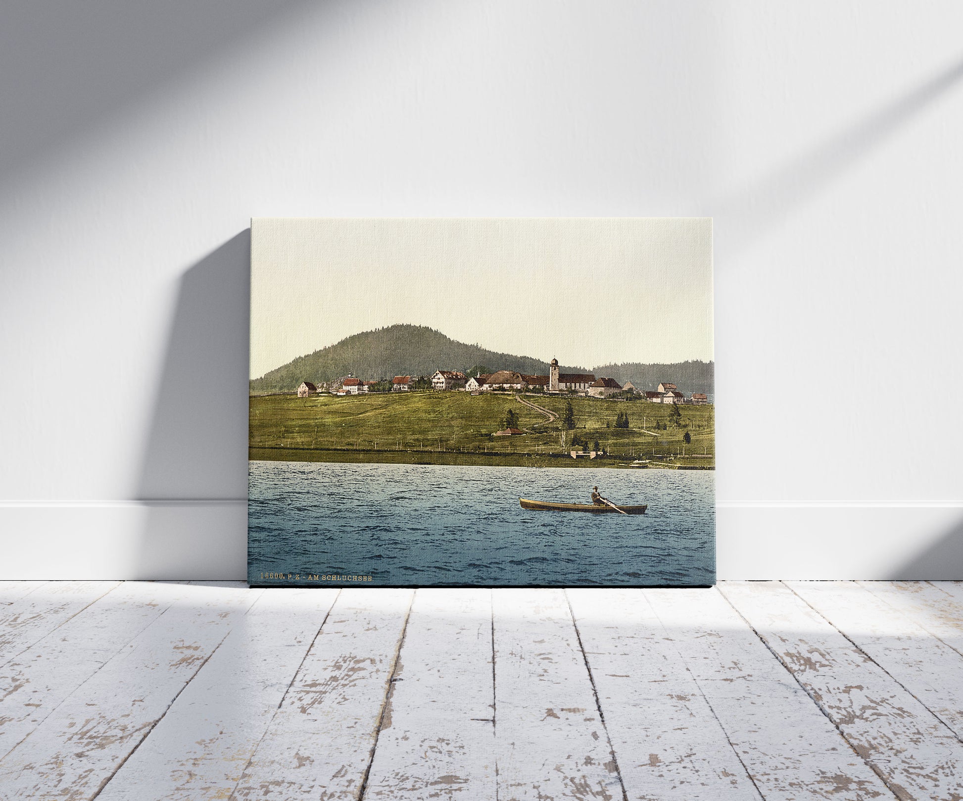 A picture of Schluchsee, general view of village, Black Forest, Baden, Germany, a mockup of the print leaning against a wall