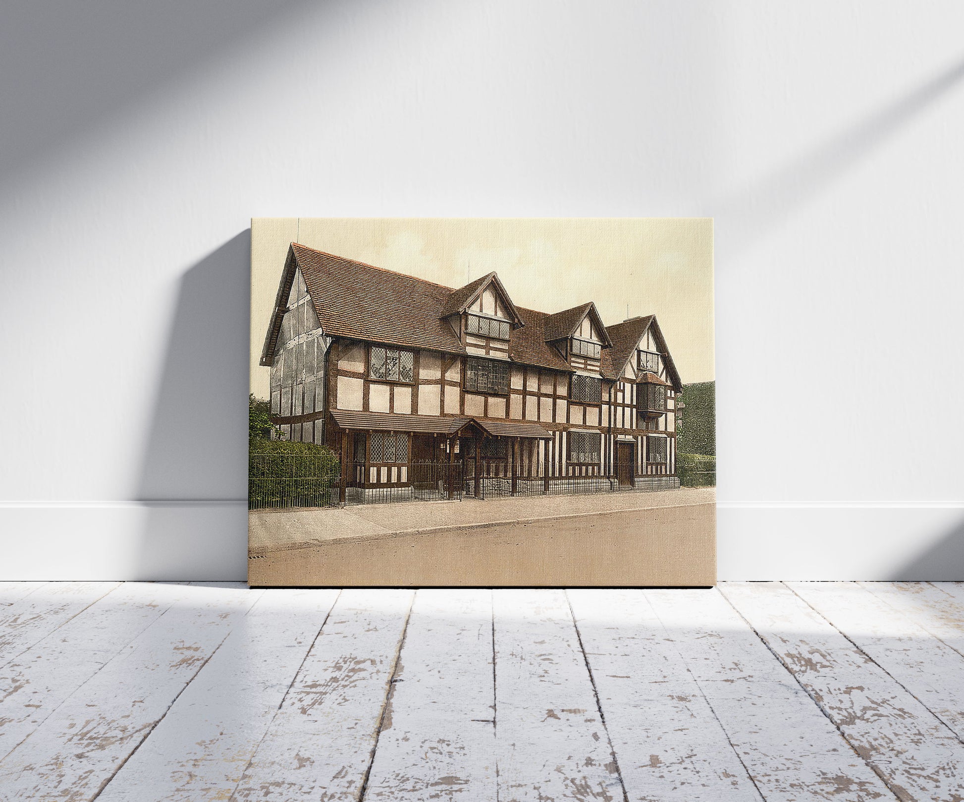 A picture of Shakespeare's birthplace, Stratford-on-Avon, England, a mockup of the print leaning against a wall