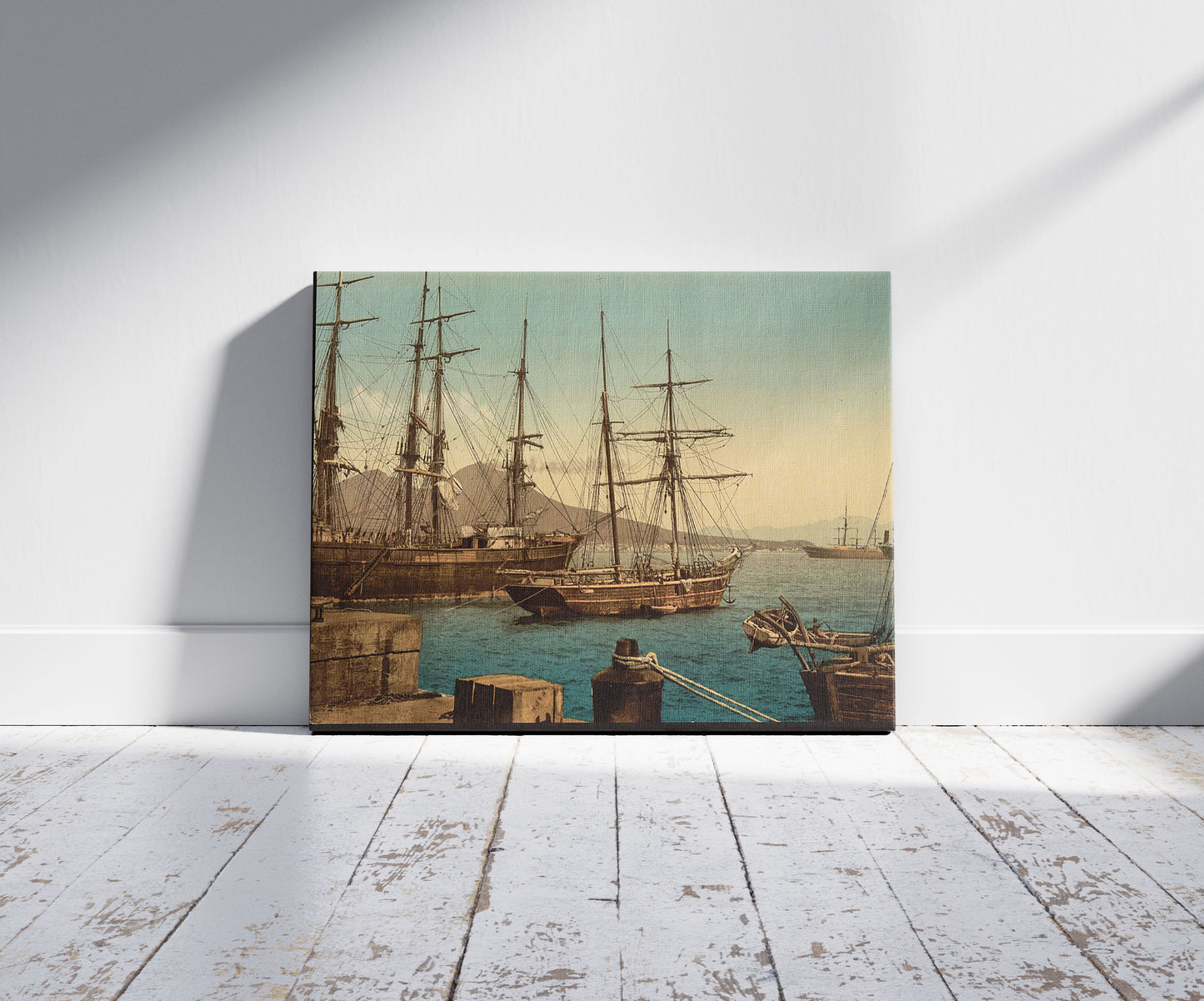 A picture of Ships in the harbor, Naples, Italy, a mockup of the print leaning against a wall