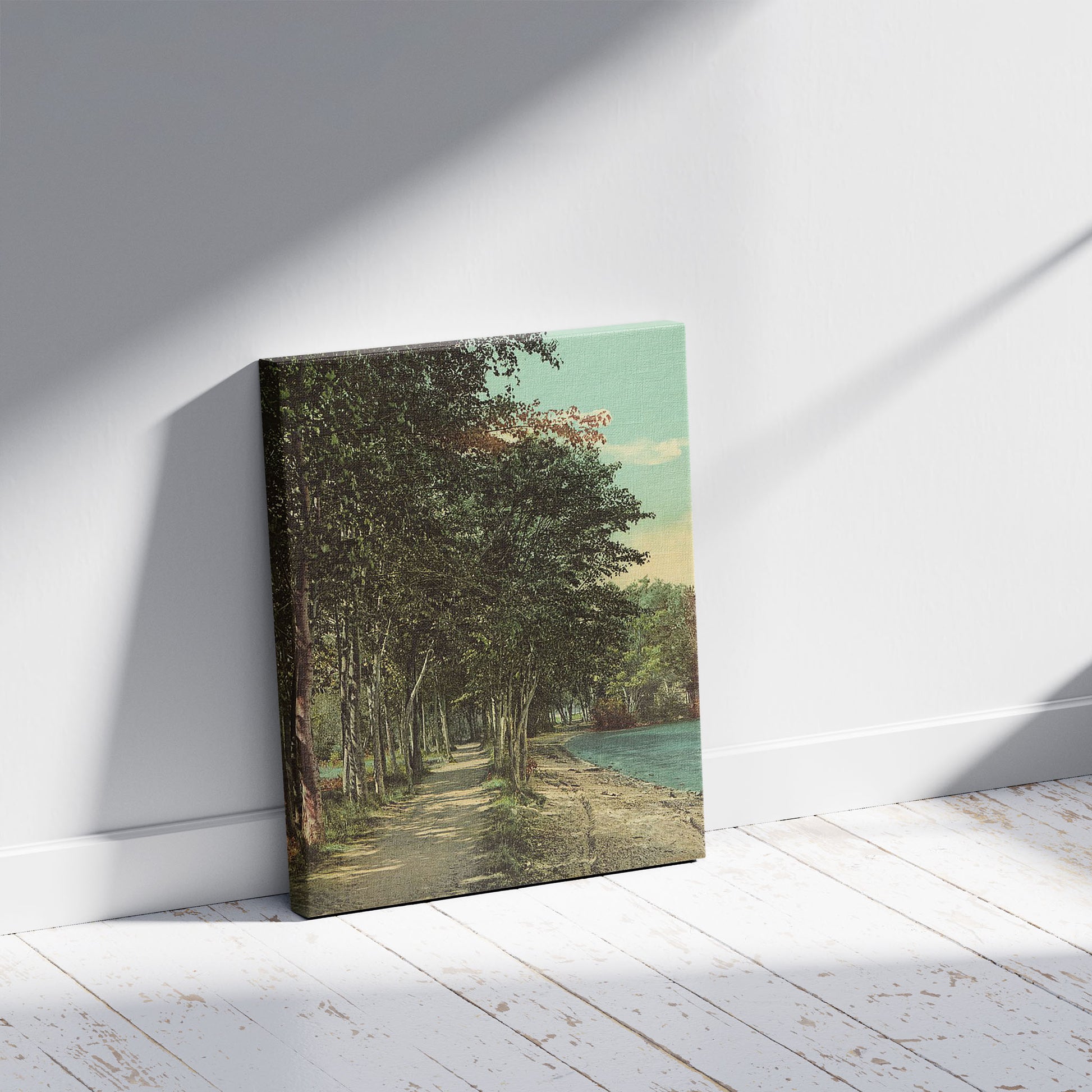 A picture of Shore path at Hulett's, Lake George, N.Y., a mockup of the print leaning against a wall