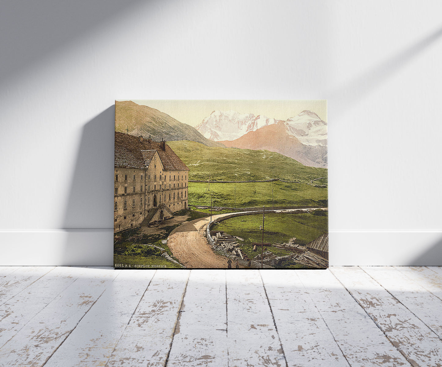 A picture of Simplon Pass, the hospice, Valais, Alps of, Switzerland, a mockup of the print leaning against a wall