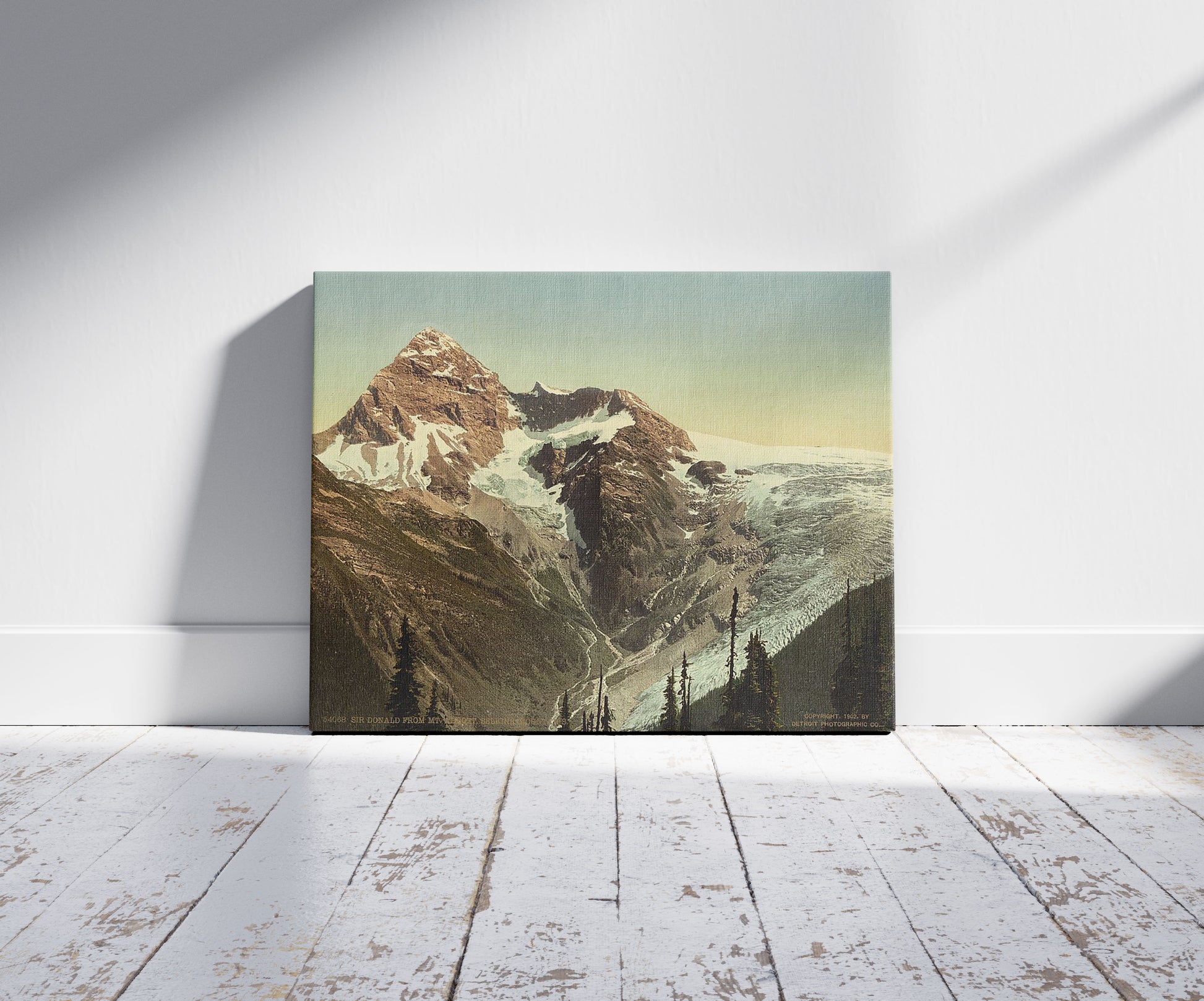 A picture of Sir Donald from Mt. Abbott, Selkirk Mountains, a mockup of the print leaning against a wall