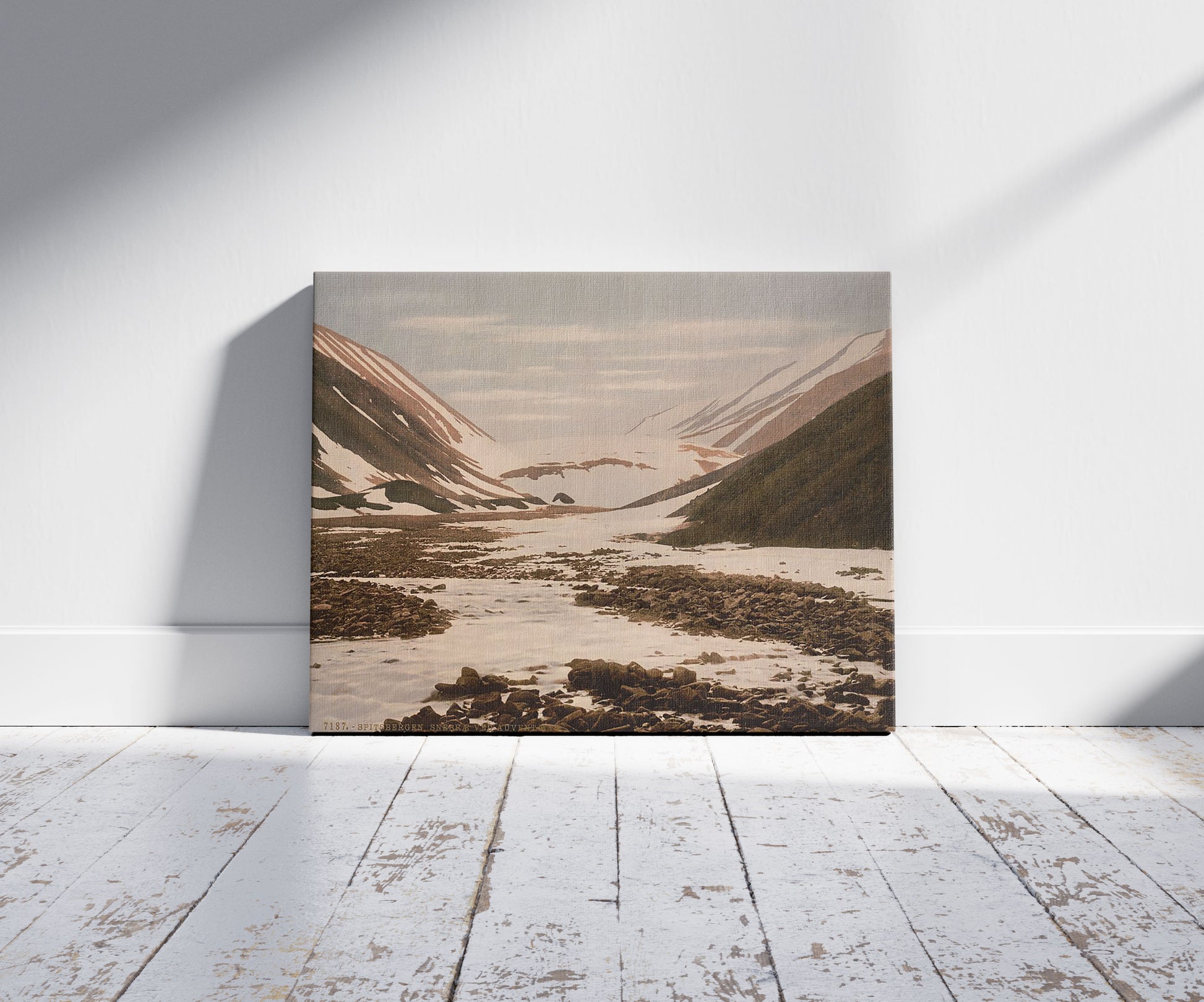 A picture of Snebrae at Advent Bay, Spitzbergen, Norway, a mockup of the print leaning against a wall