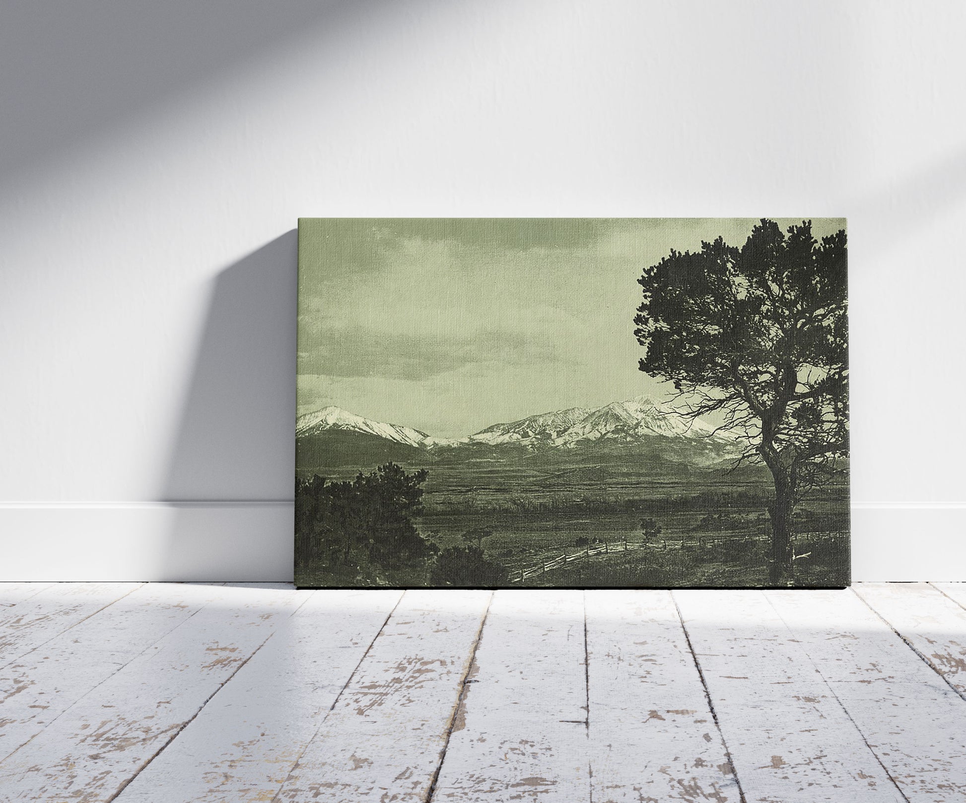 A picture of Spanish Peaks, a mockup of the print leaning against a wall