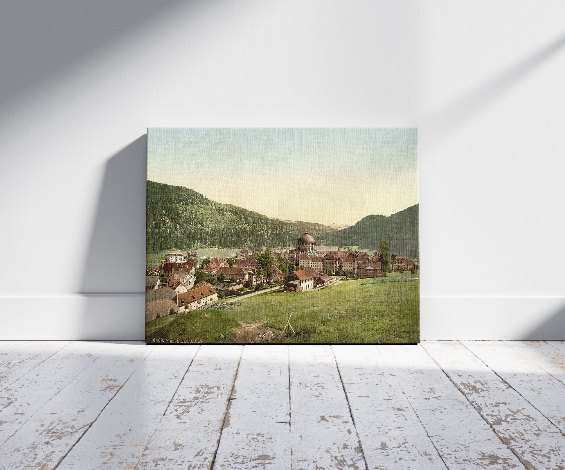 A picture of St. Blasien, general view, Black Forest, Baden, Germany, a mockup of the print leaning against a wall